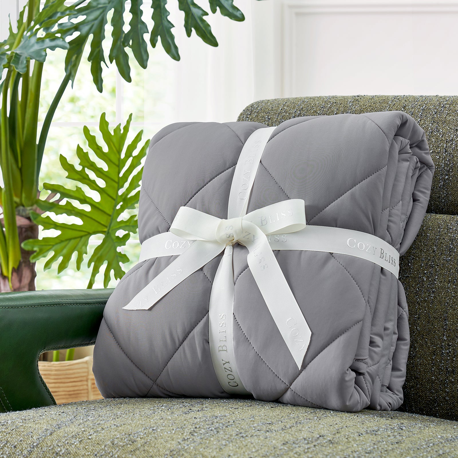 Cozy Bliss gray cooling blanket tied with ribbon, perfect for hot sleepers and cozy comfort. #Color_Dark Grey