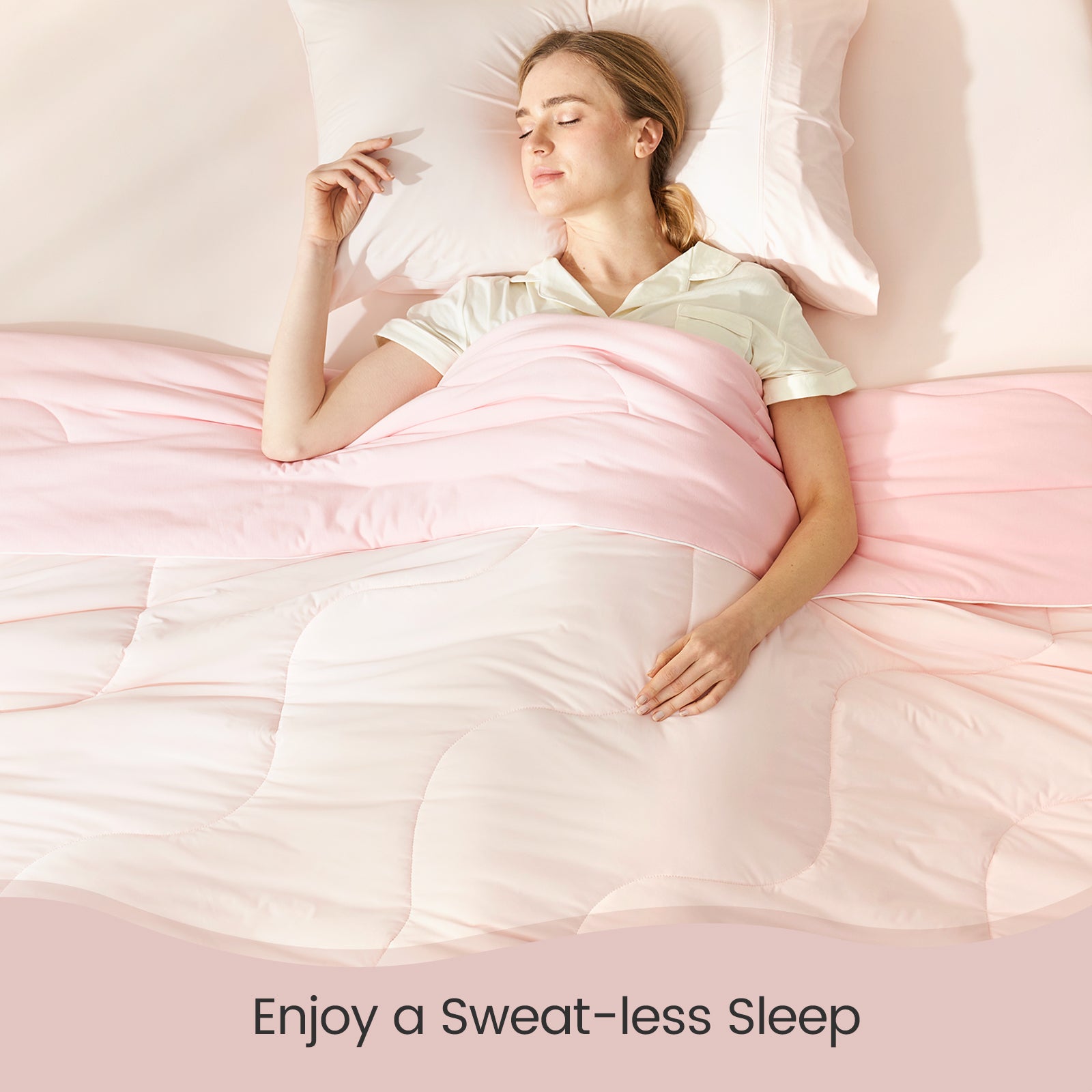 Woman sleeping comfortably under Cozy Bliss cooling comforter #color_Cool Pink#color_Cool Pink