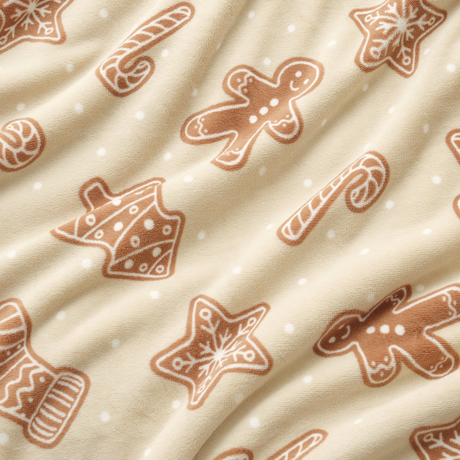 Pattern of gingerbread cookies on a beige fabric background #color_Christmas Gingerbread