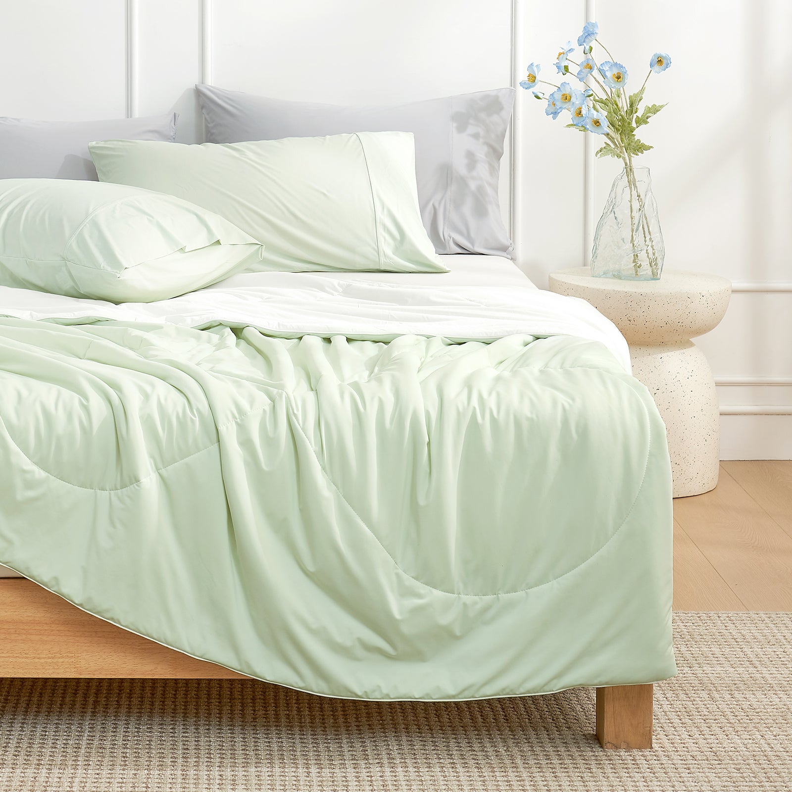 Light mint green and cream Cozy Bliss cooling comforter on bed, soft breathable dual-tone reversible bedding. #Color_Light Mint Green/Cream