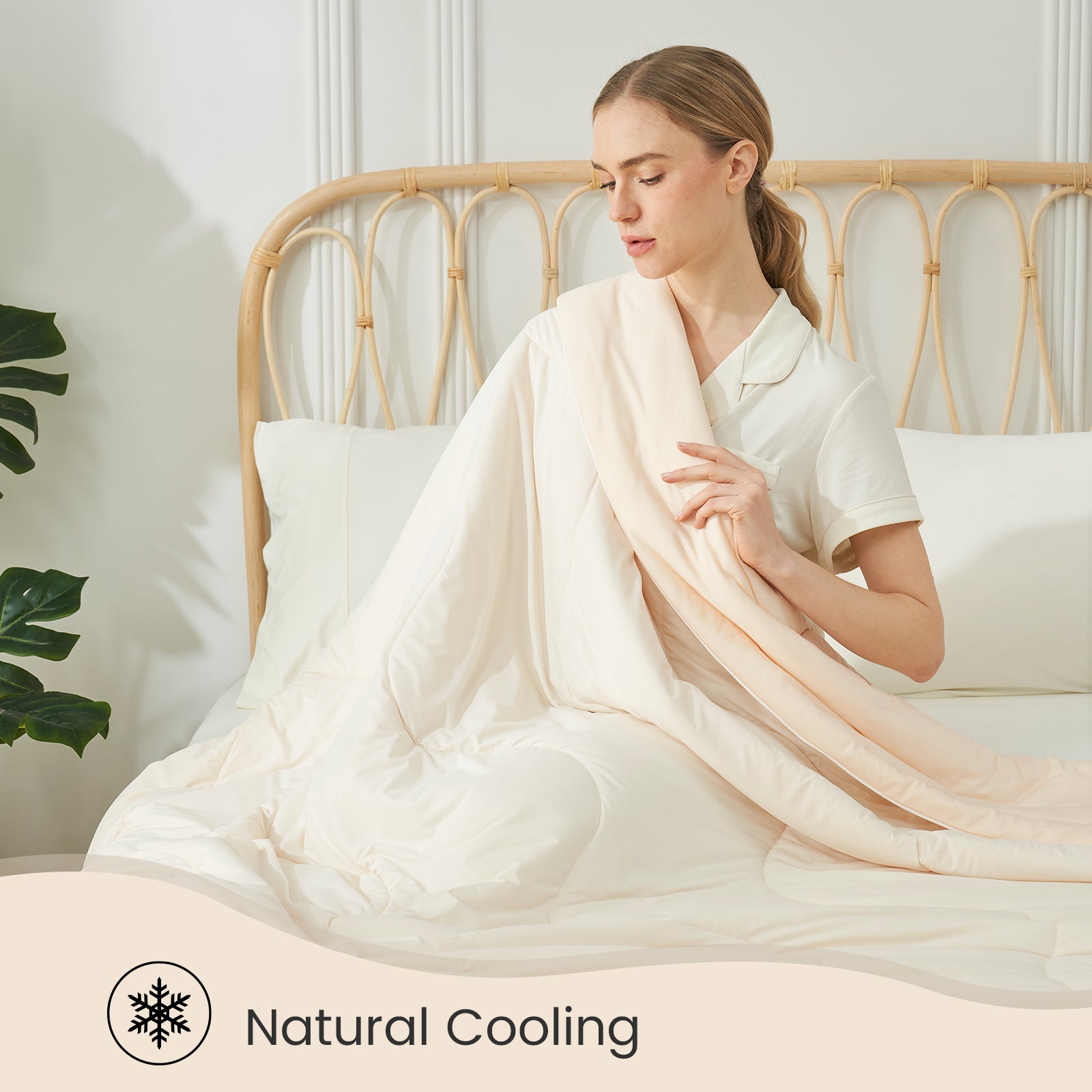 Woman with Cozy Bliss cooling comforter, natural cooling #color_Ivory