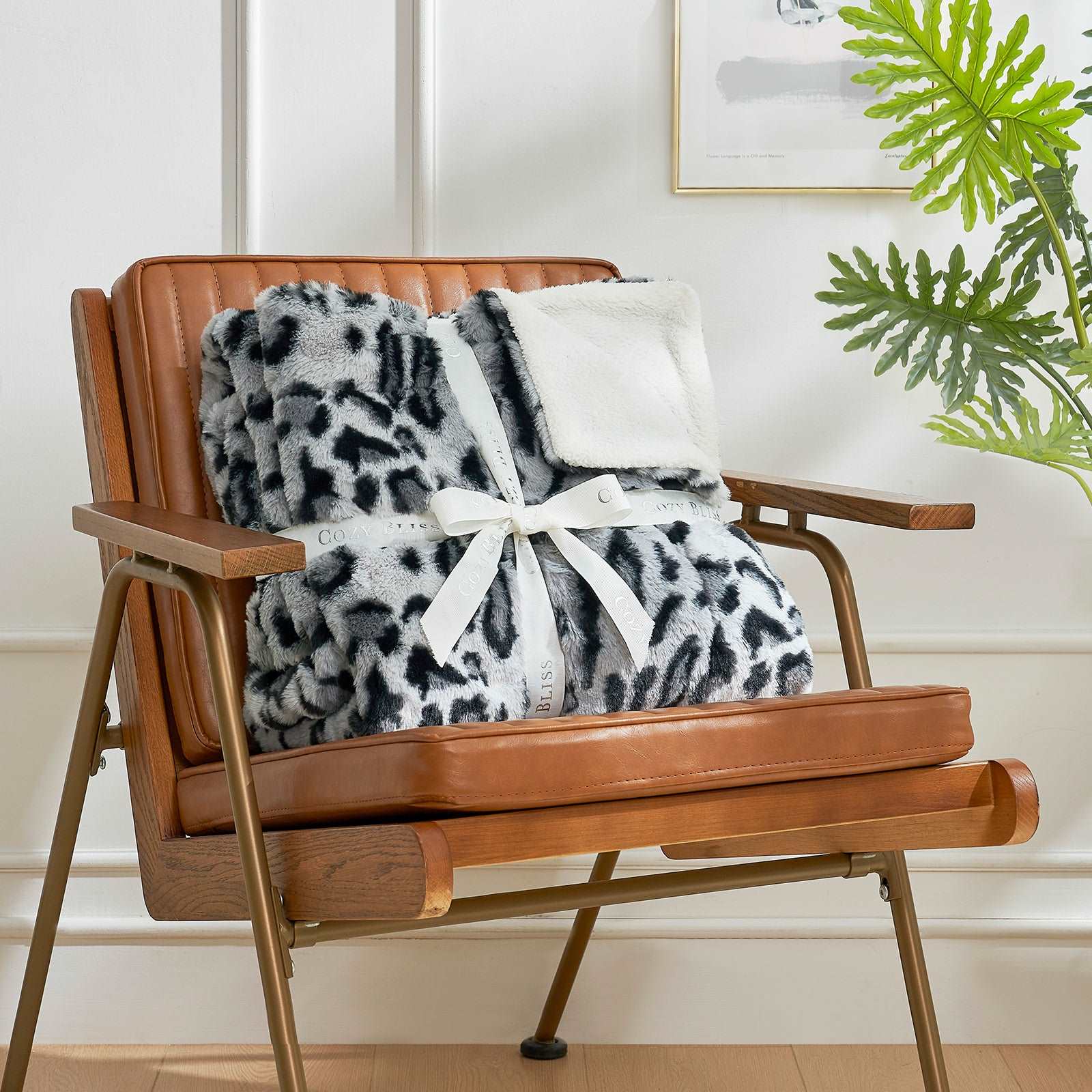 Leopard print blanket on a chair, Cozy Bliss faux fur throw #color_Snow Leopard