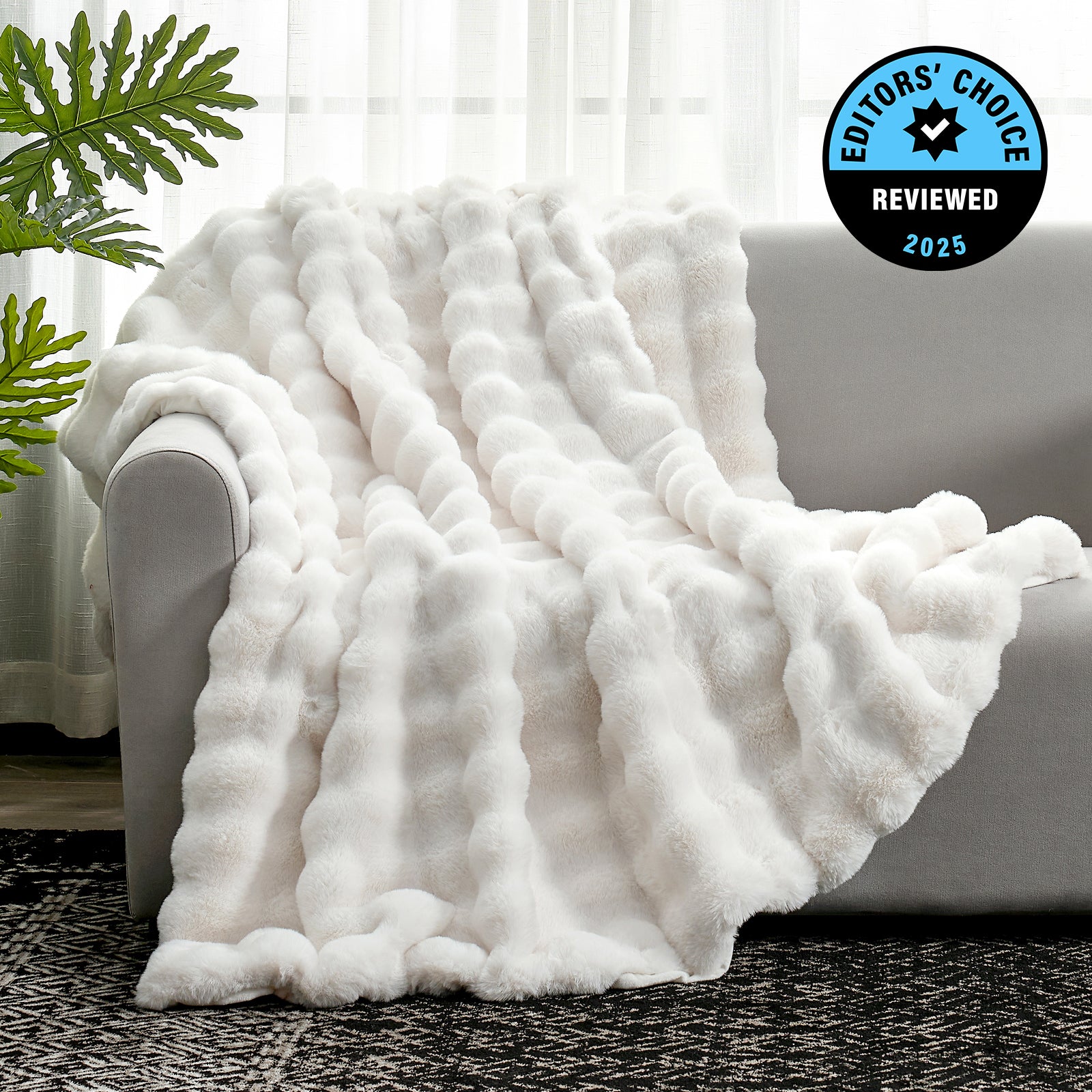 White fluffy blanket draped over a sofa with an 'Editors' Choice' badge in the corner. #Color_Cream White