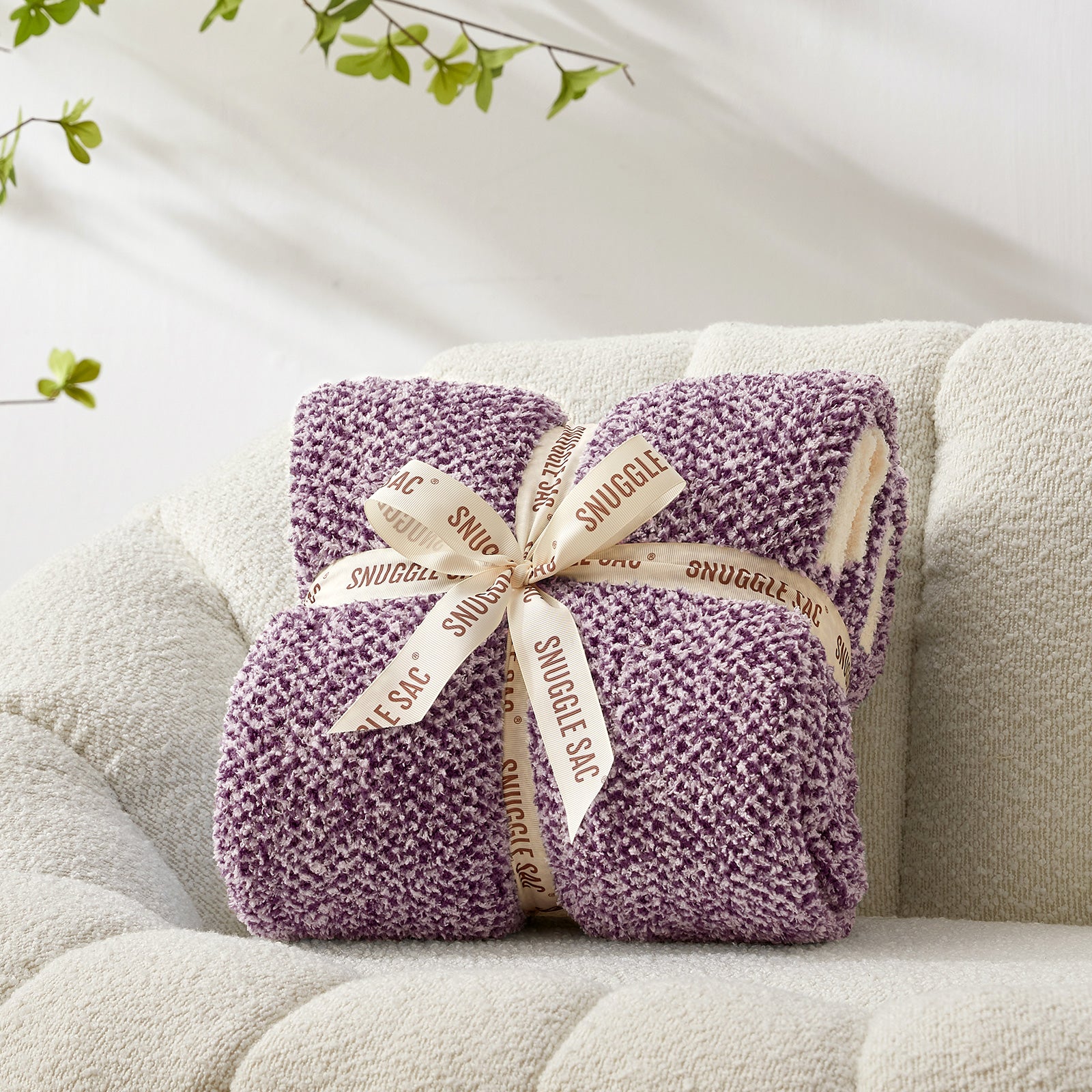 Heather Feather Yarn Throw Blanket in Lilac neatly folded with ribbon, a perfect gift idea for holidays, housewarming or special occasions. #Color_Lilac
