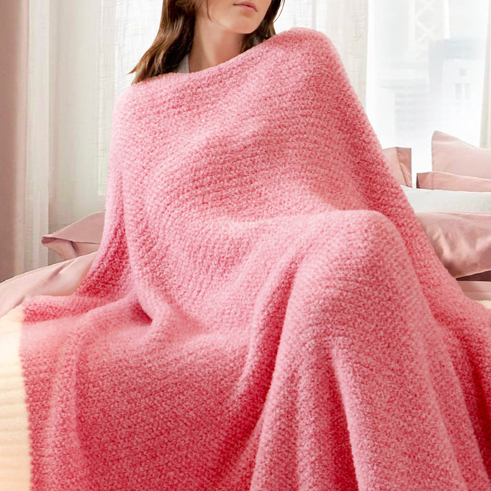 Woman wrapped in a Heather Feather Yarn Throw Blanket in Hot Pink, relaxing comfortably. #color_Hot Pink