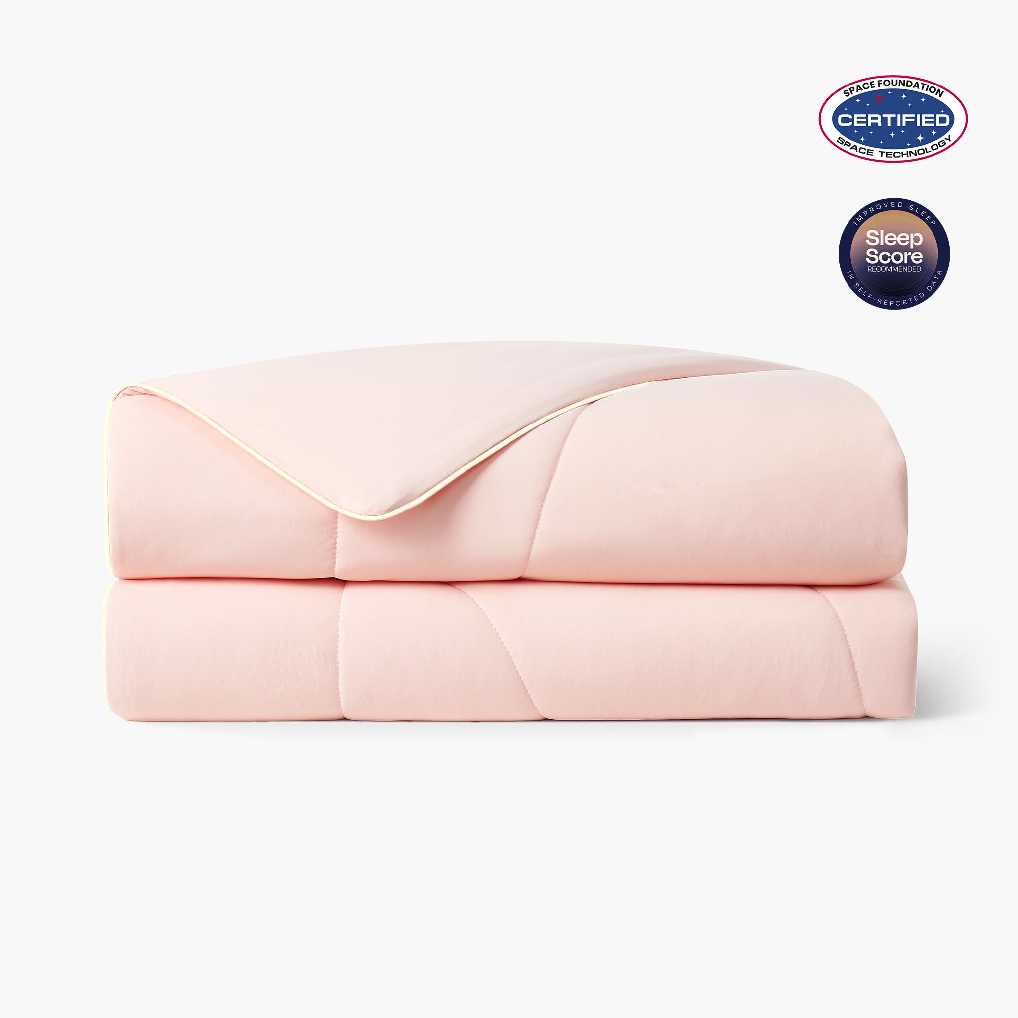Folded pink cooling comforter with Space Foundation and Sleep Score certification logo on a white background#color_Pink