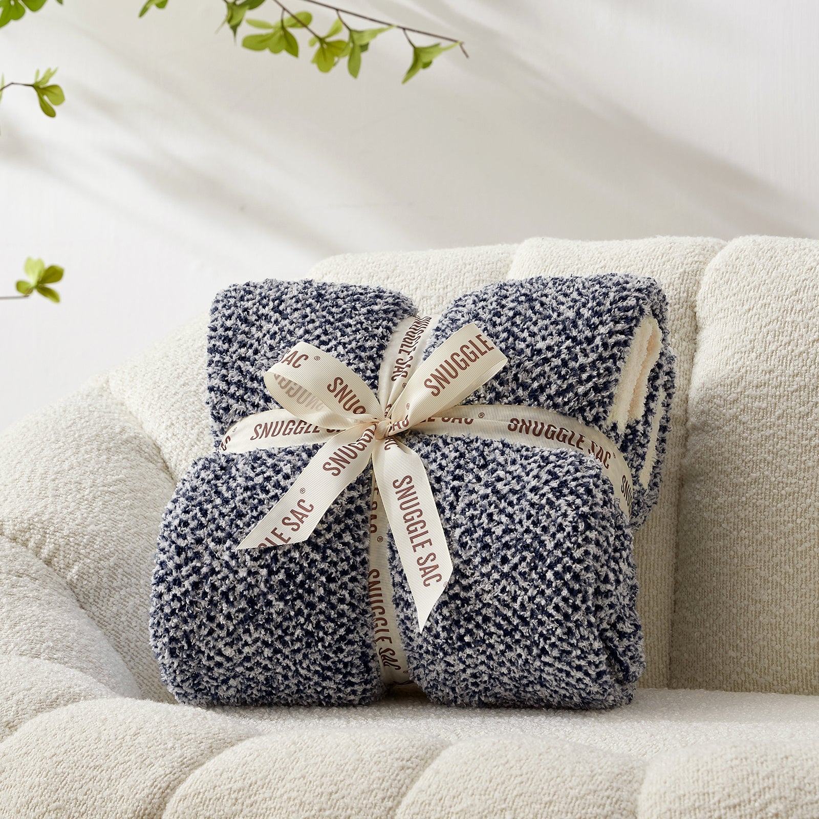 Heather Feather Yarn Throw Blanket in navy blue neatly folded with ribbon, a perfect gift idea for holidays, housewarming or special occasions. #Color_Navy Blue