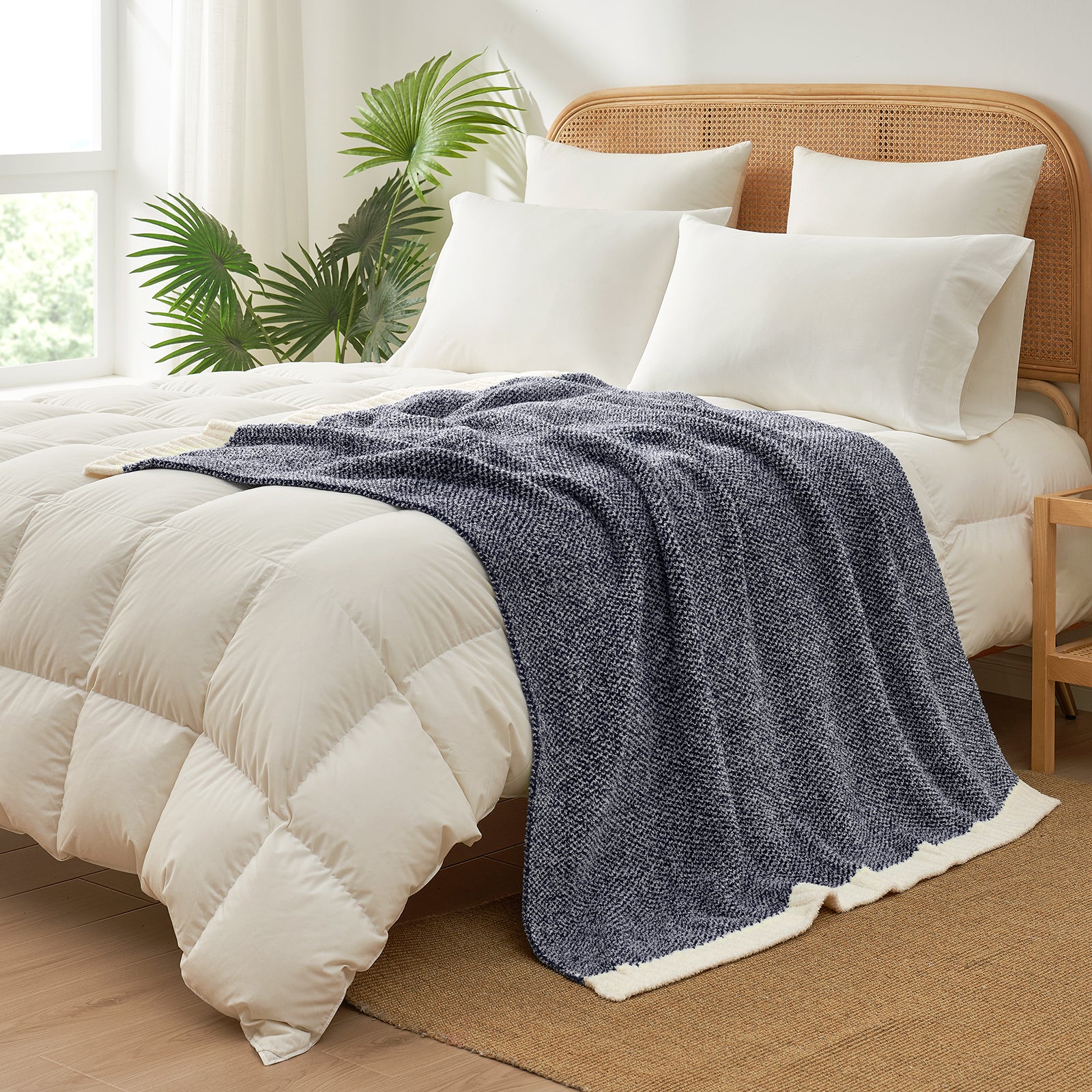 Heather Feather Yarn Throw Blanket in navy blue styled on a bed, enhancing bedroom decor with a soft, elegant and cozy layered look. #Color_Navy Blue
