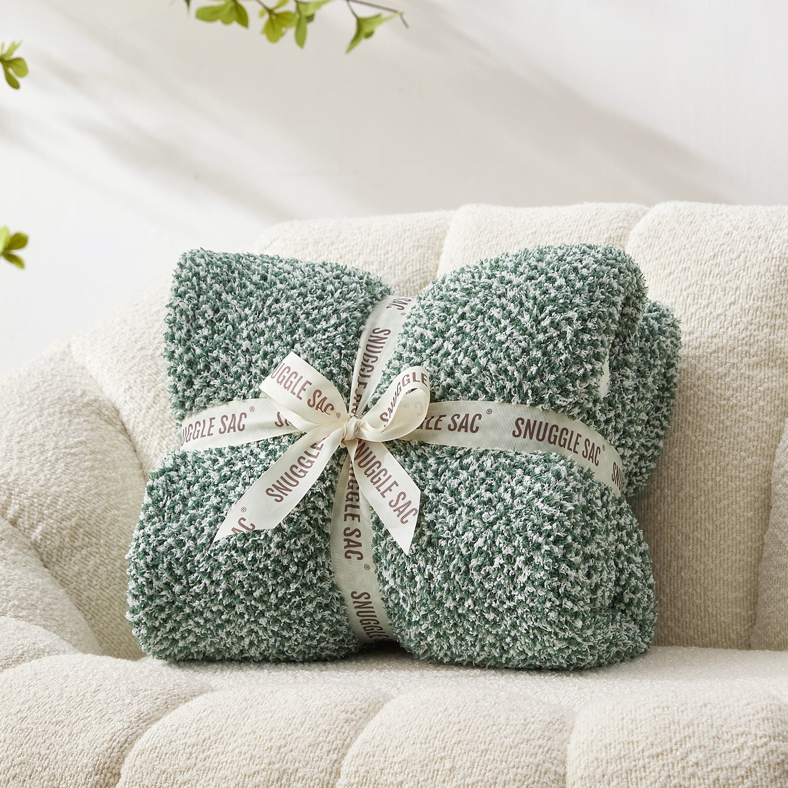 Heather Feather Yarn Throw Blanket in heather green neatly folded with ribbon, a perfect gift idea for holidays, housewarming or special occasions. #Color_Heather Green