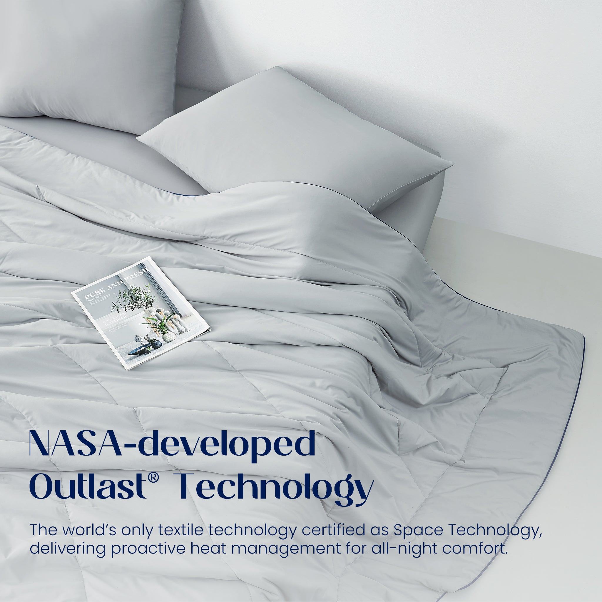 Gray bedding with a pillow and magazine on a bed, featuring NASA-developed Outlast Technology text.#color_Cool Grey