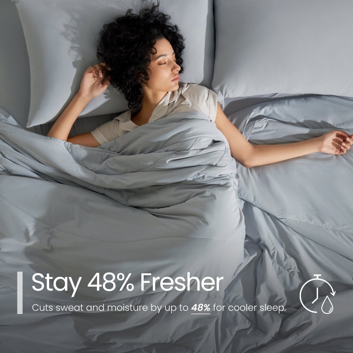 Woman sleeping under grey bedding with text about staying fresher#color_Light Grey
