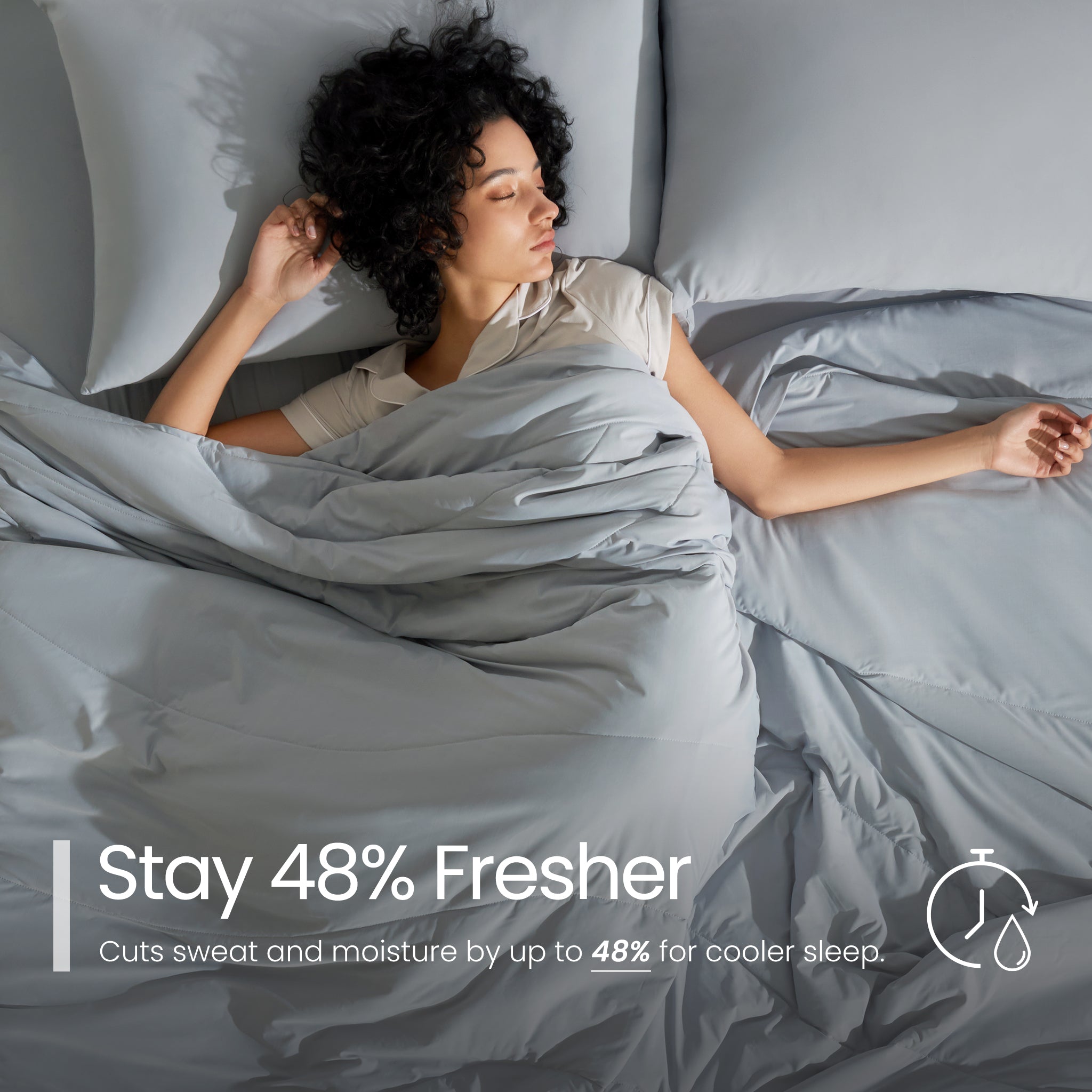 Woman sleeping under grey bedding with text about staying fresher#color_Light Grey