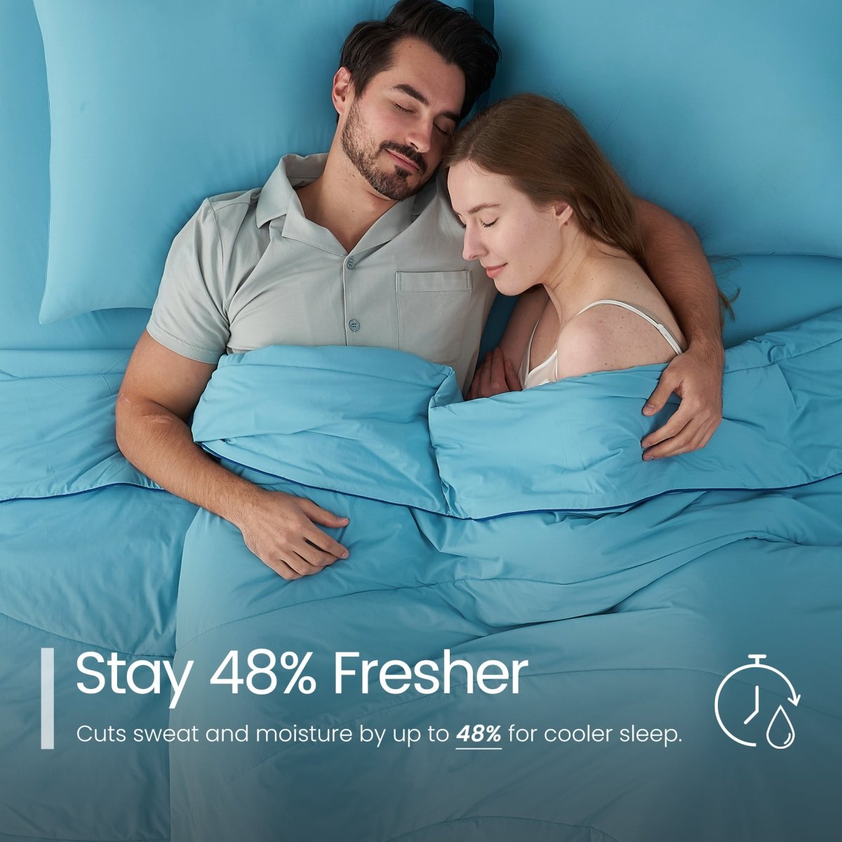 Man and woman lying in bed under blue bedding with text about staying fresher.#color_Dream Blue