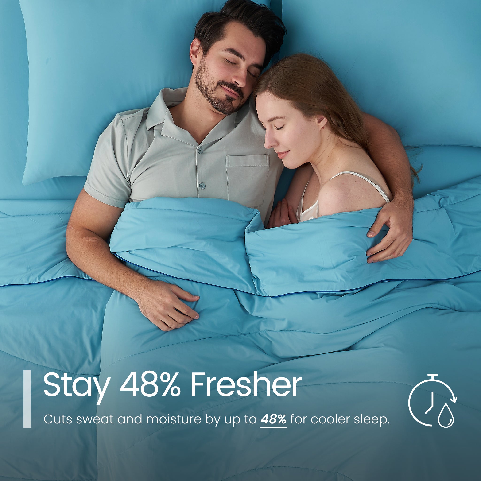 Man and woman lying in bed under blue bedding with text about staying fresher.#color_Dream Blue