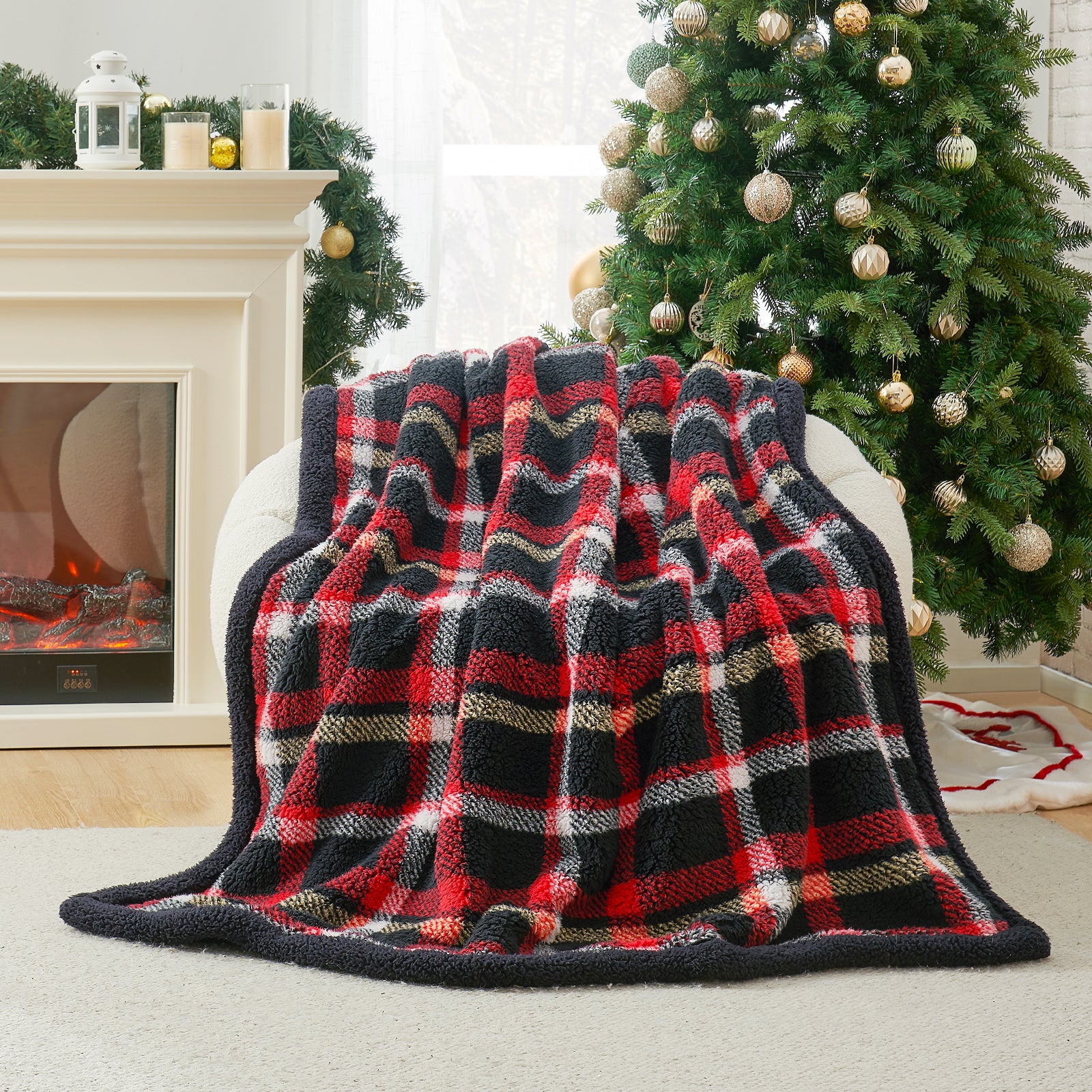 Plaid blanket draped over a chair in front of a Christmas tree and fireplace. #Color_Scotland Plaid Red