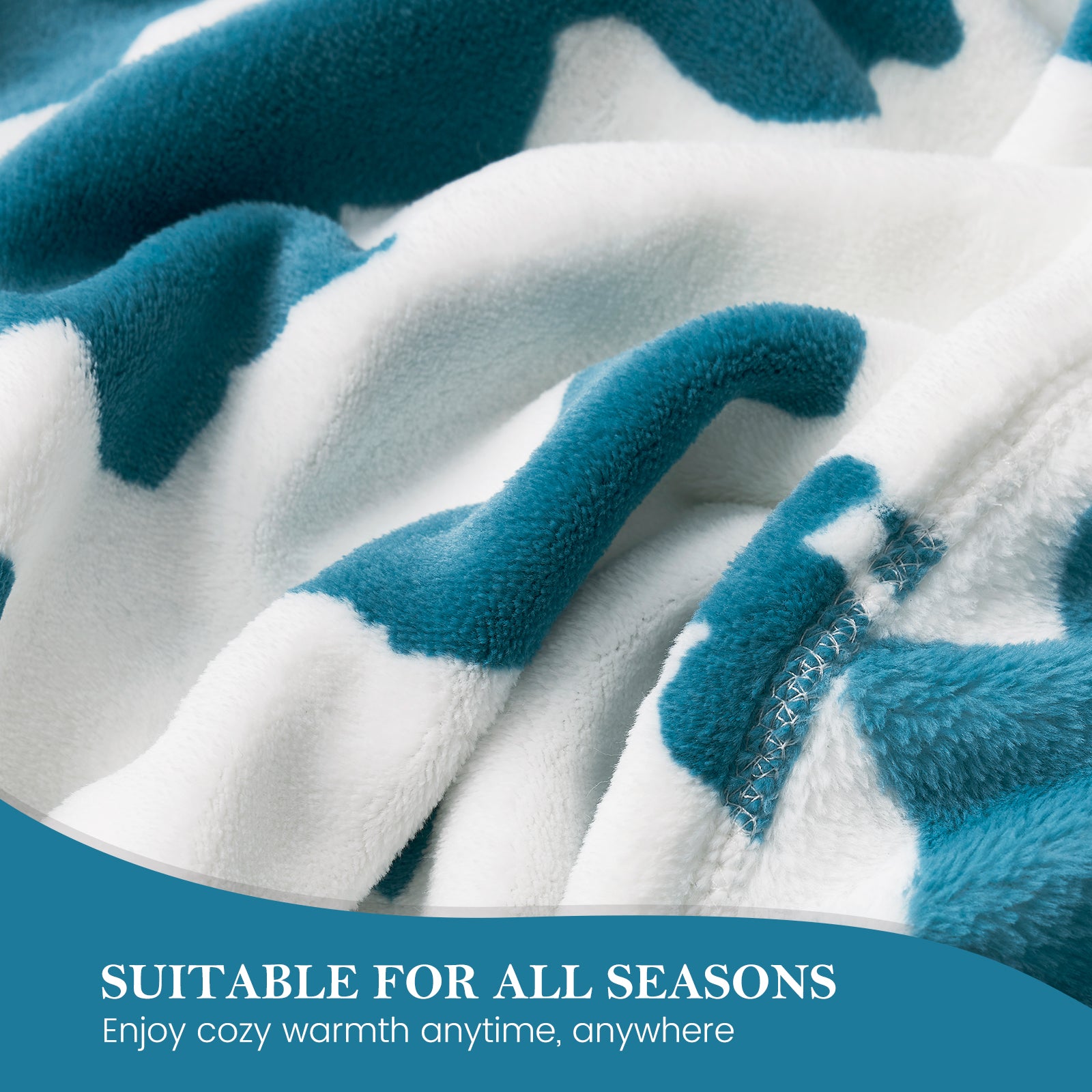 Close-up of a blue and white fleece blanket with text 'Suitable for all seasons'.  #color_Blue