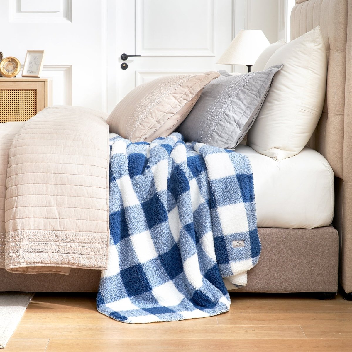 Buffalo sherpa throw blanket in Buffalo Plaid-navy blue draped over bed, creating a warm and cozy bedroom look #color_Buffalo Plaid-navy blue