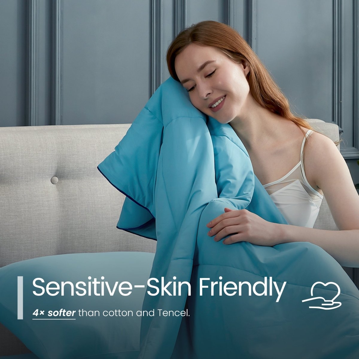 Woman wrapped in a blue blanket on a couch with 'Sensitive-Skin Friendly' text.#color_Dream Blue