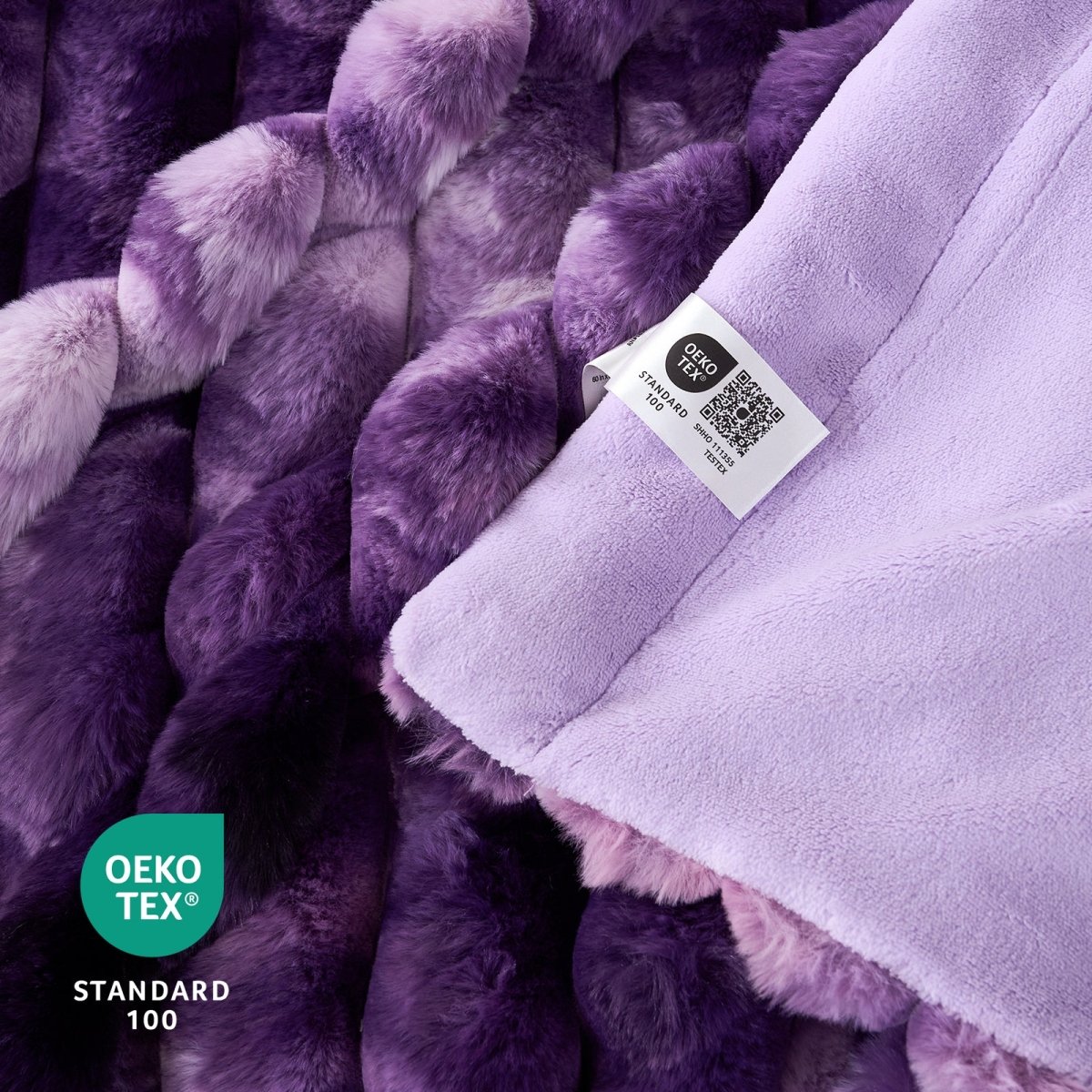 Close-up of Purple textured fabric with a label and Oeko-Tex label. #color_Tie-dye Purple