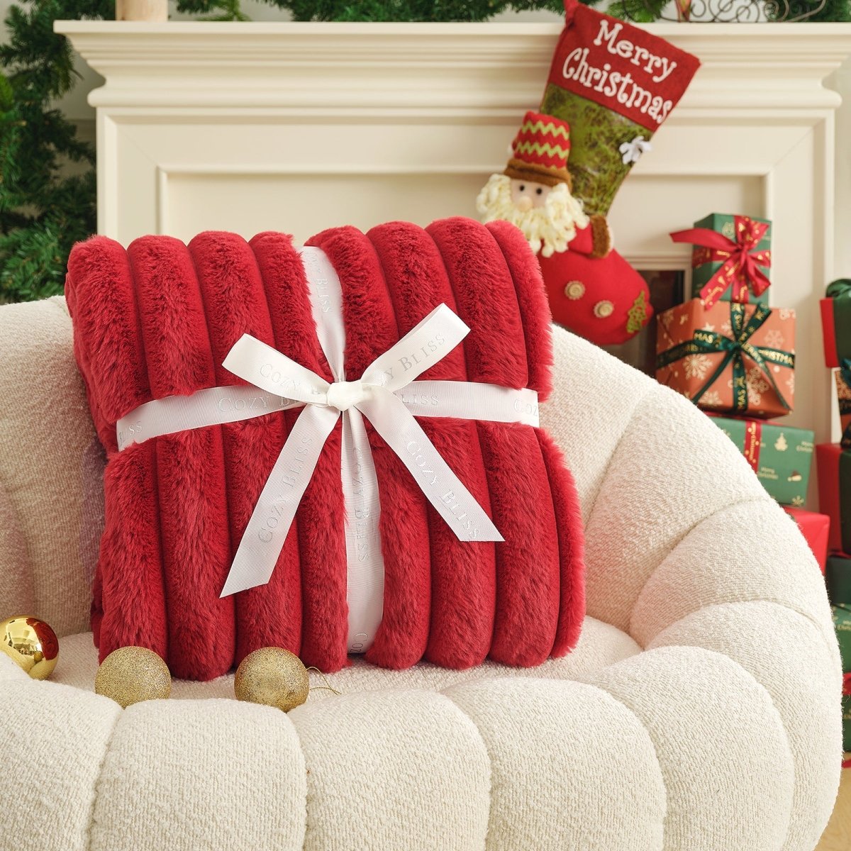 Red blanket with a white bow on a white armchair in a festive setting with Christmas decorations. #color_Christmas Red