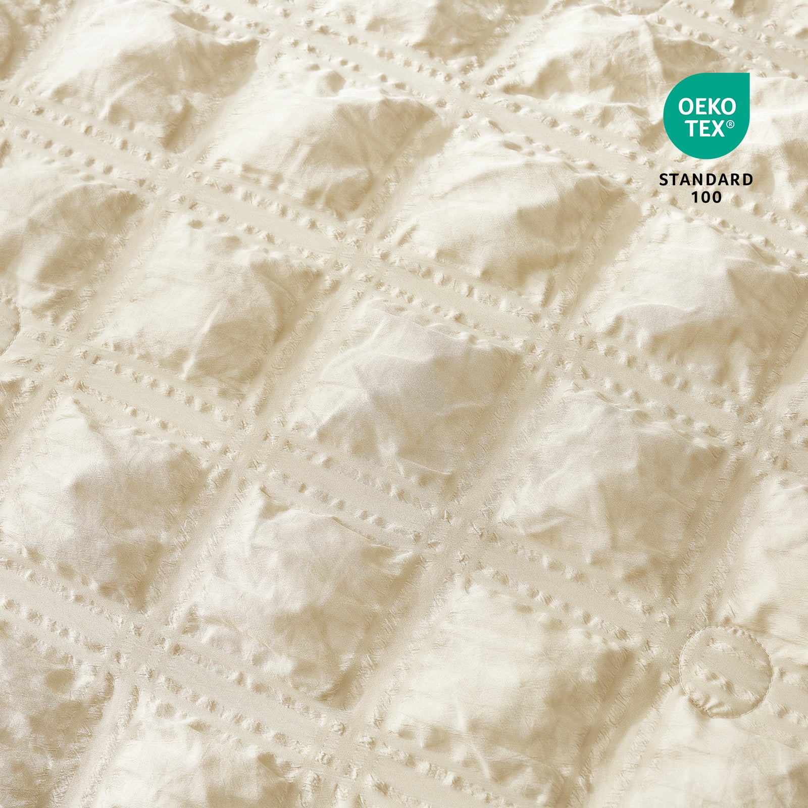 Close-up of Cozy Bliss Textured beige fabric with OEKO-TEX Standard 100 certification.#color_Beige