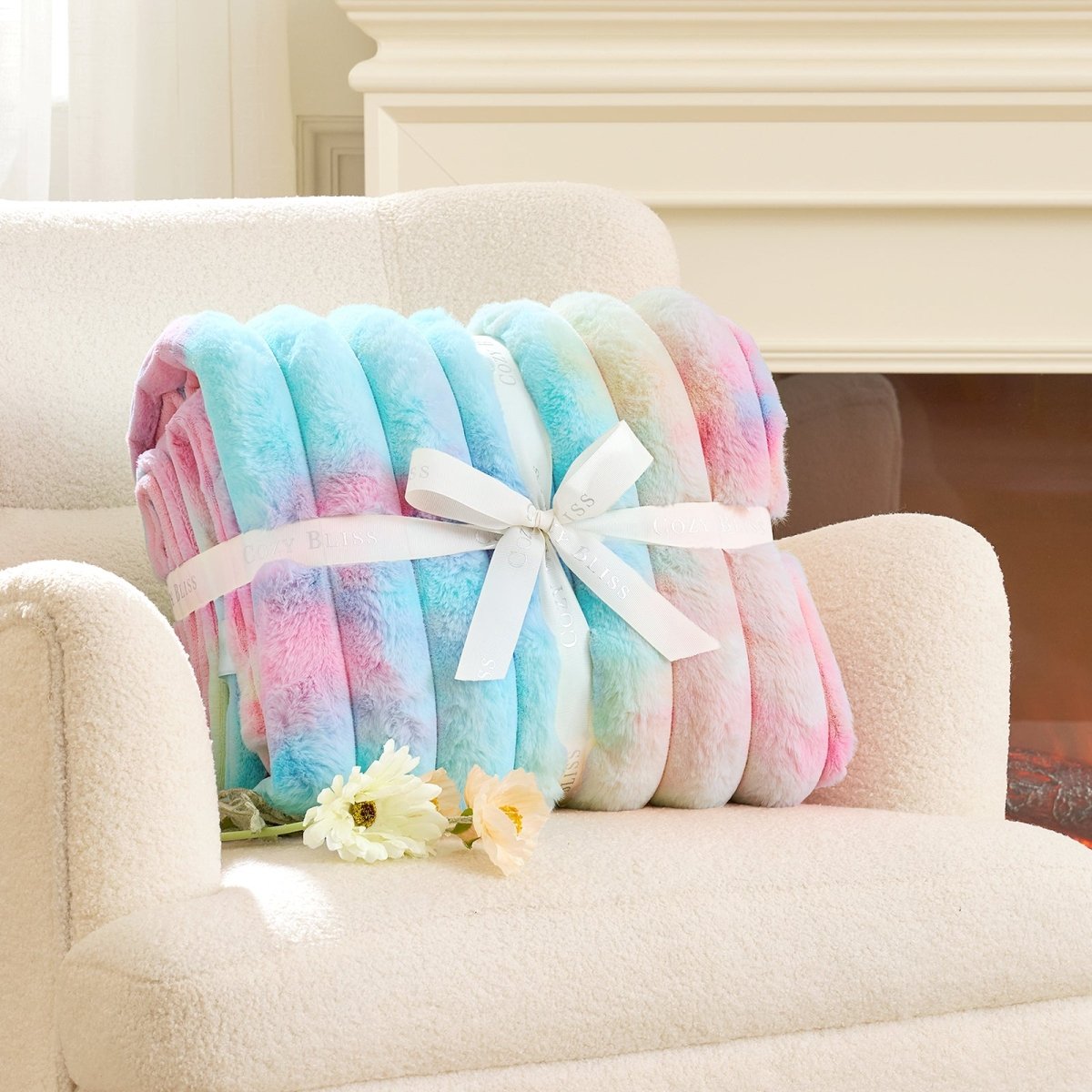 Colorful blanket with a white bow on a beige armchair in a cozy living room. #color_Tie-dye Rainbow