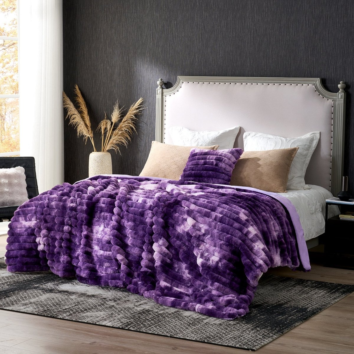 Purple textured blanket on a bed in a bedroom setting. #color_Tie-dye Purple