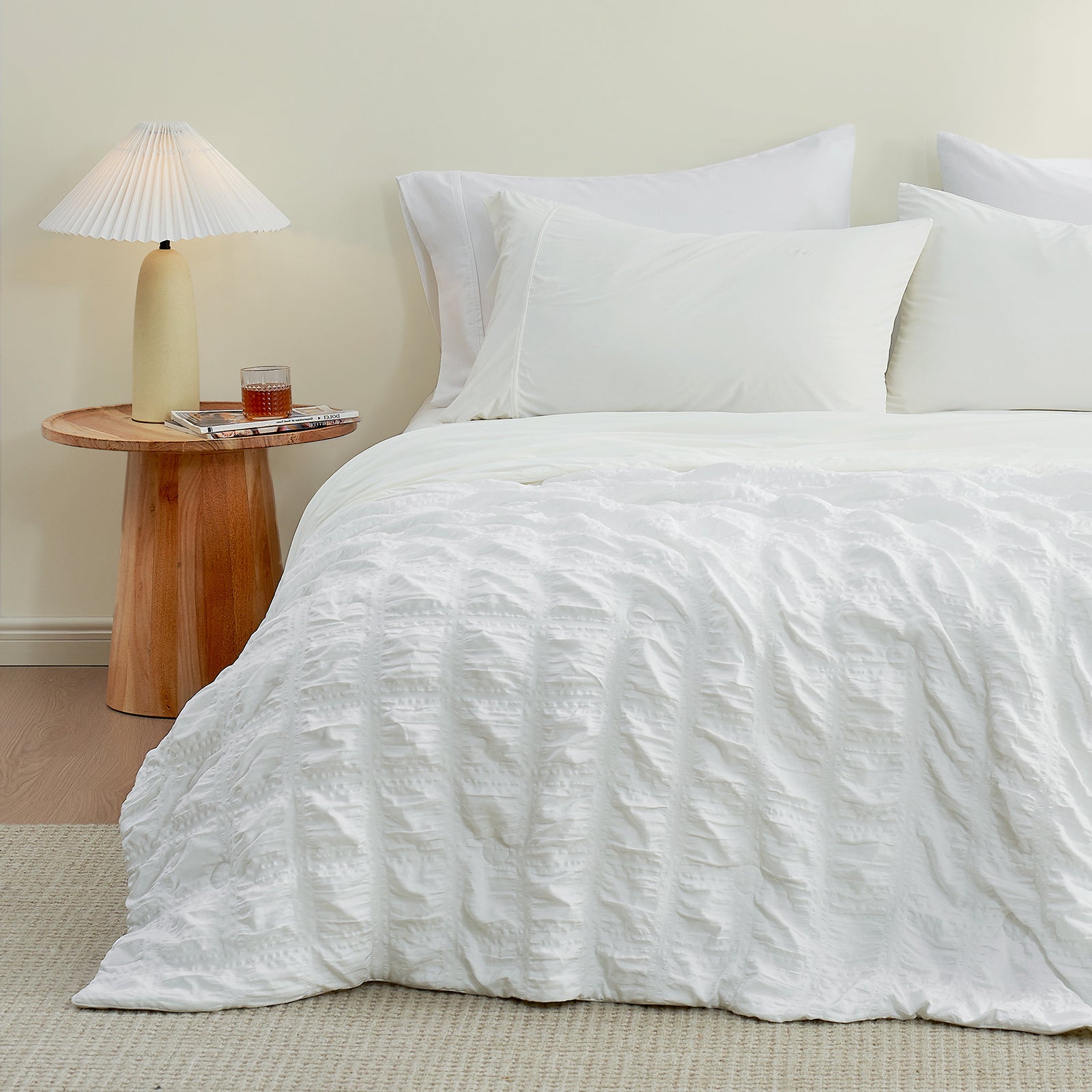 White seersucker cooling comforter on a bed, cozy bedding #Color_White Plaid