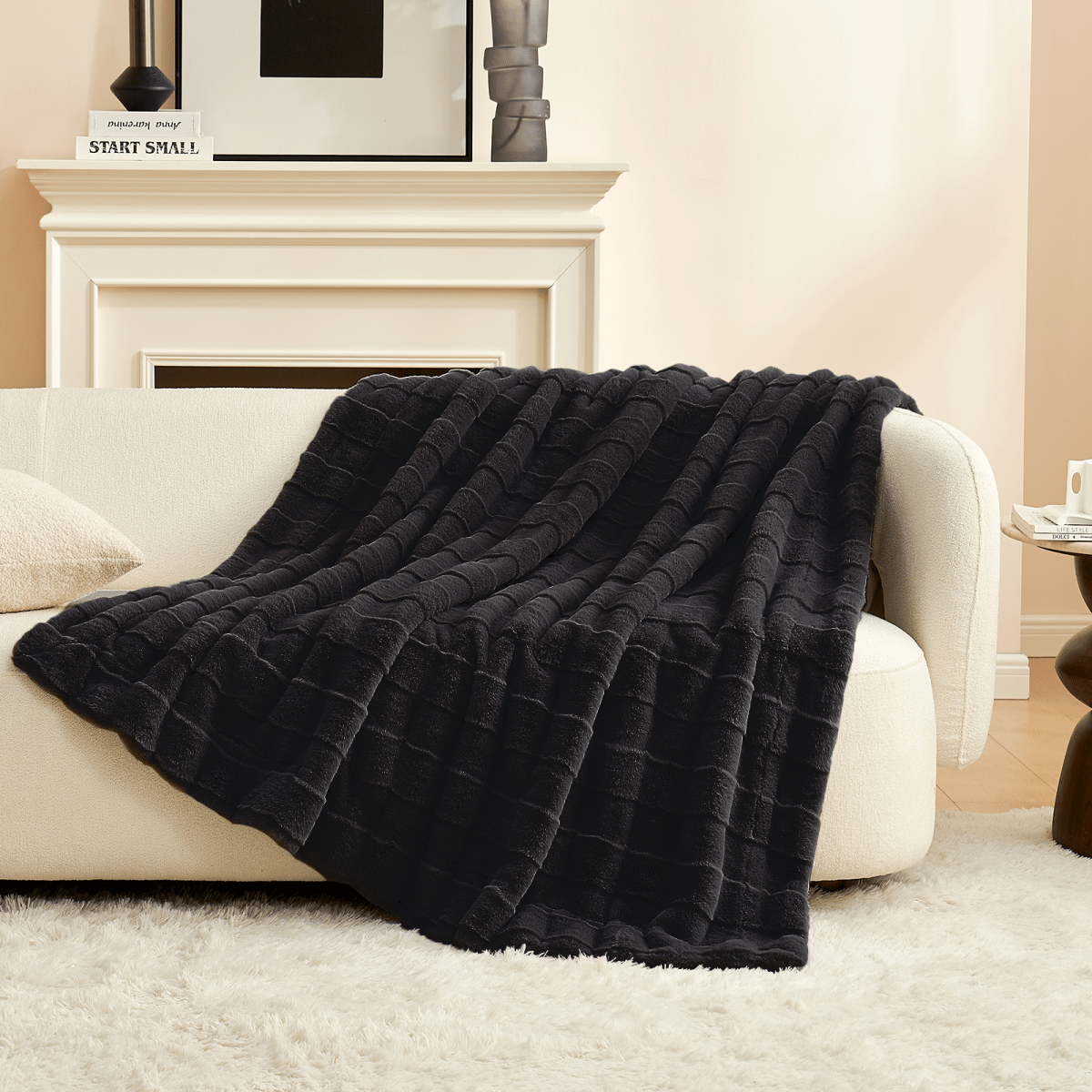 Cozy Bliss Cross-Striped Faux Fur Throw Blanket in black draped over a couch #color_Black