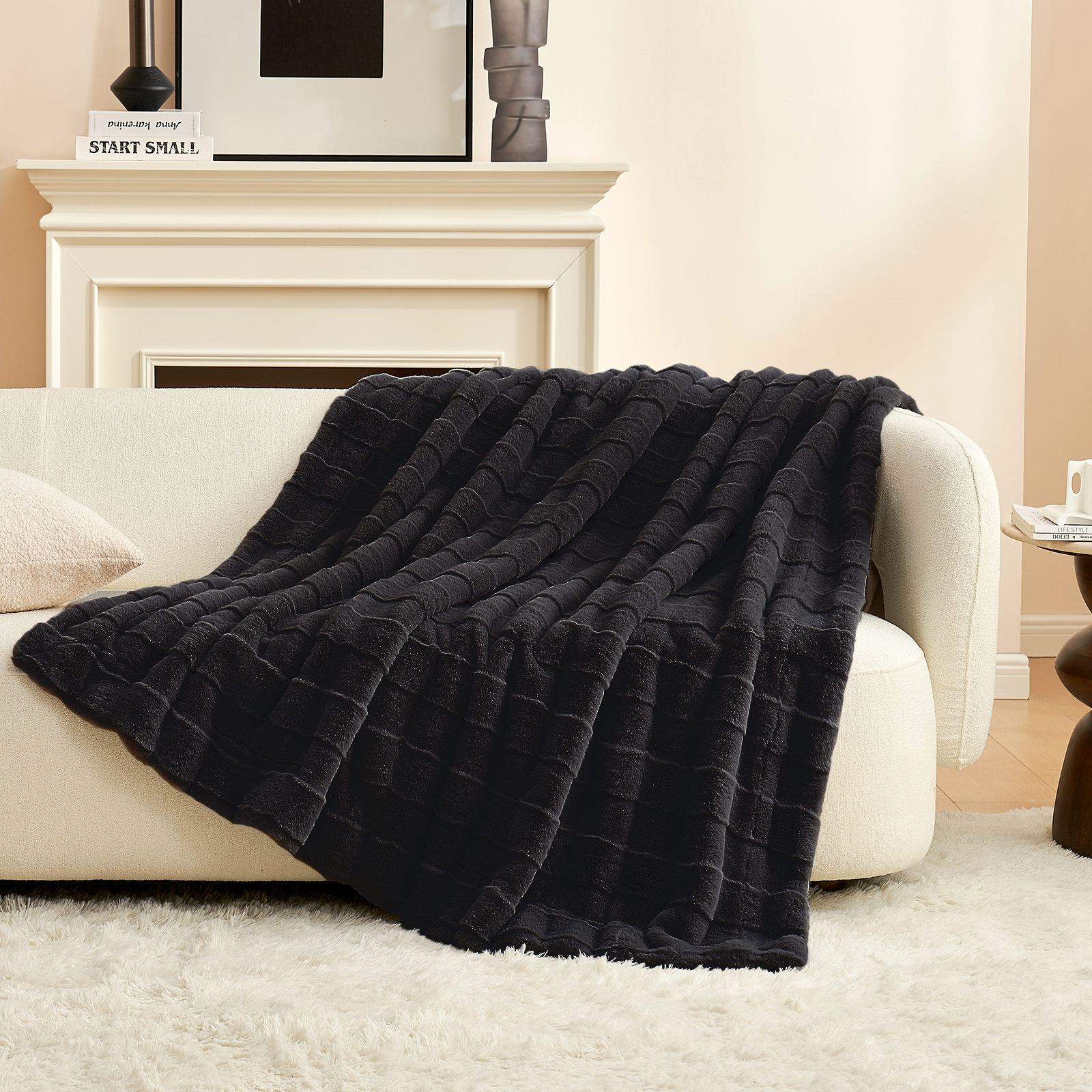 Cozy Bliss Cross-Striped Faux Fur Throw Blanket in black draped over a couch #color_Black