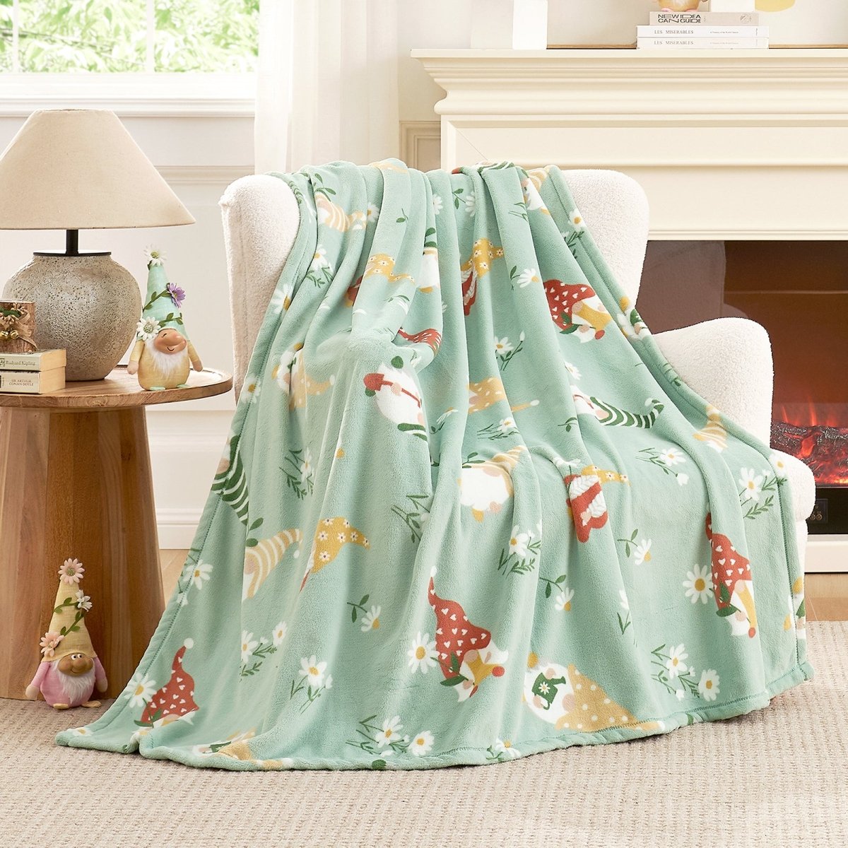 Spring gnomes milkyplush throw blanket in Green draped over a chair, creating a soft and cozy spring atmosphere #color_Sage Green