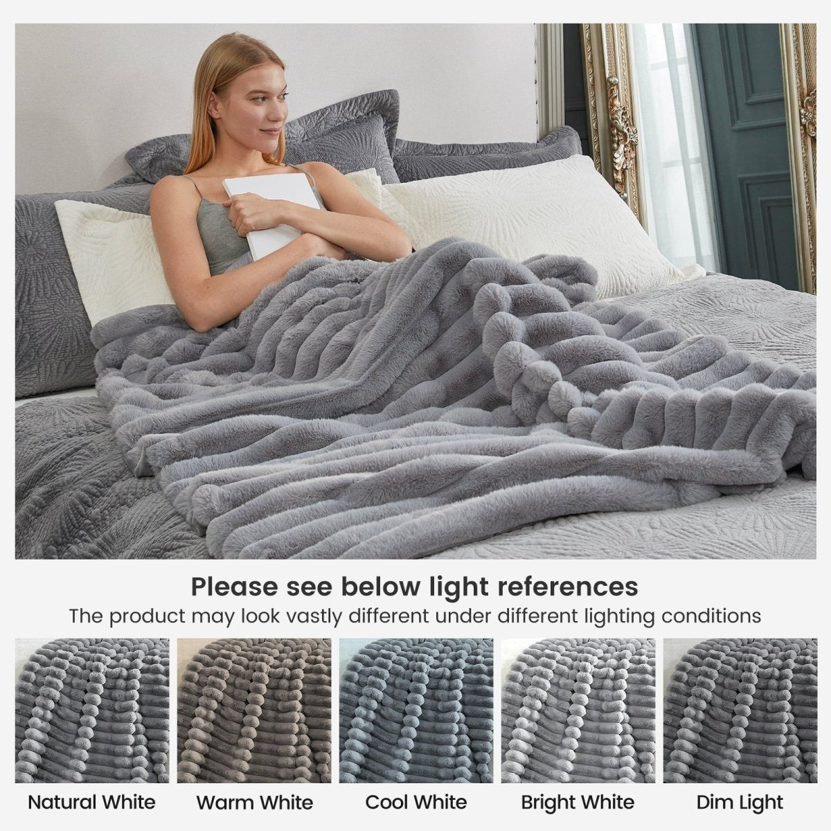 Woman lying on bed with Grey Cozy Bliss faux fur blanket on bed, showing color variations under different lights. Soft, cozy bedding. #color_Grey