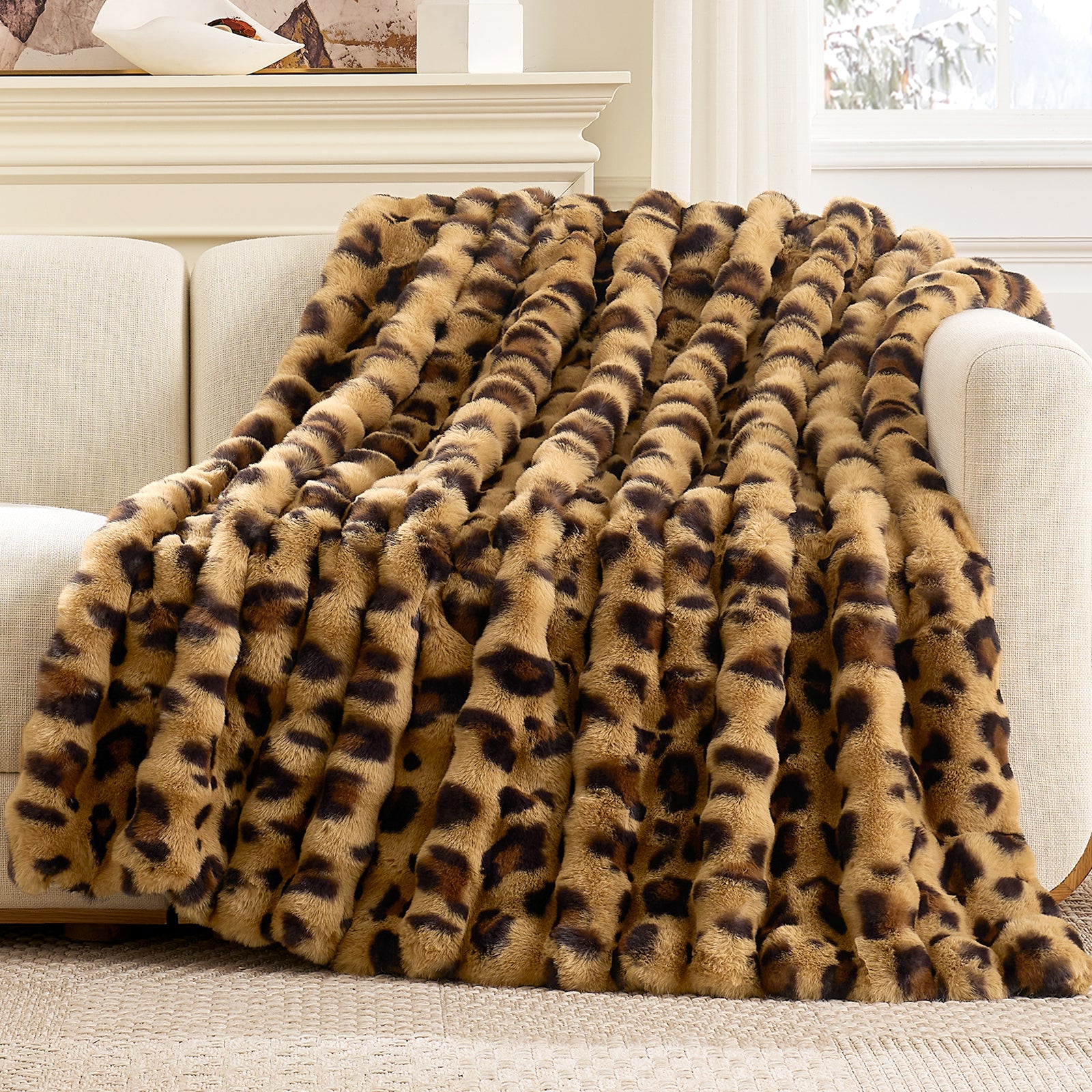 Cozy Bliss Bubble Faux Fur Throw Blanket draped over a couch #color_Bown Leopard