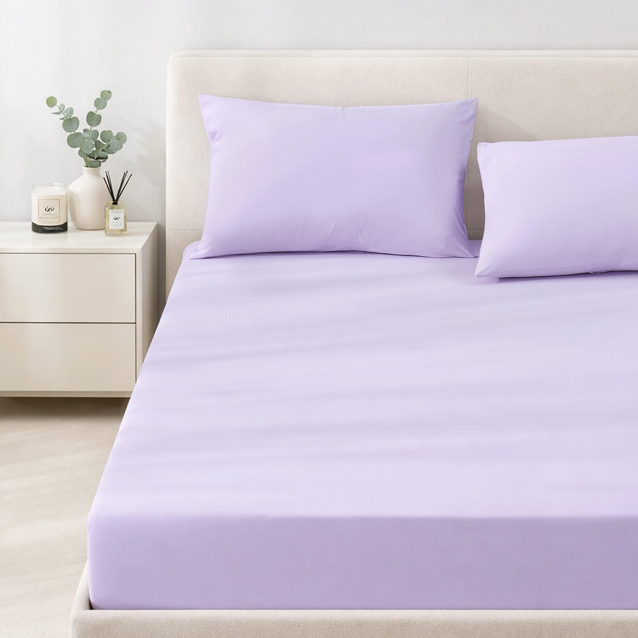 Lavender cooling bedding set on a bed in a minimalistic bedroom setting.#color_Purple