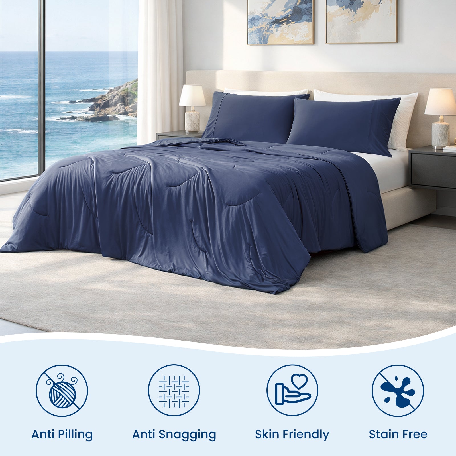 Dark blue cooling comforter on bed in coastal bedroom.#color_Dark Blue