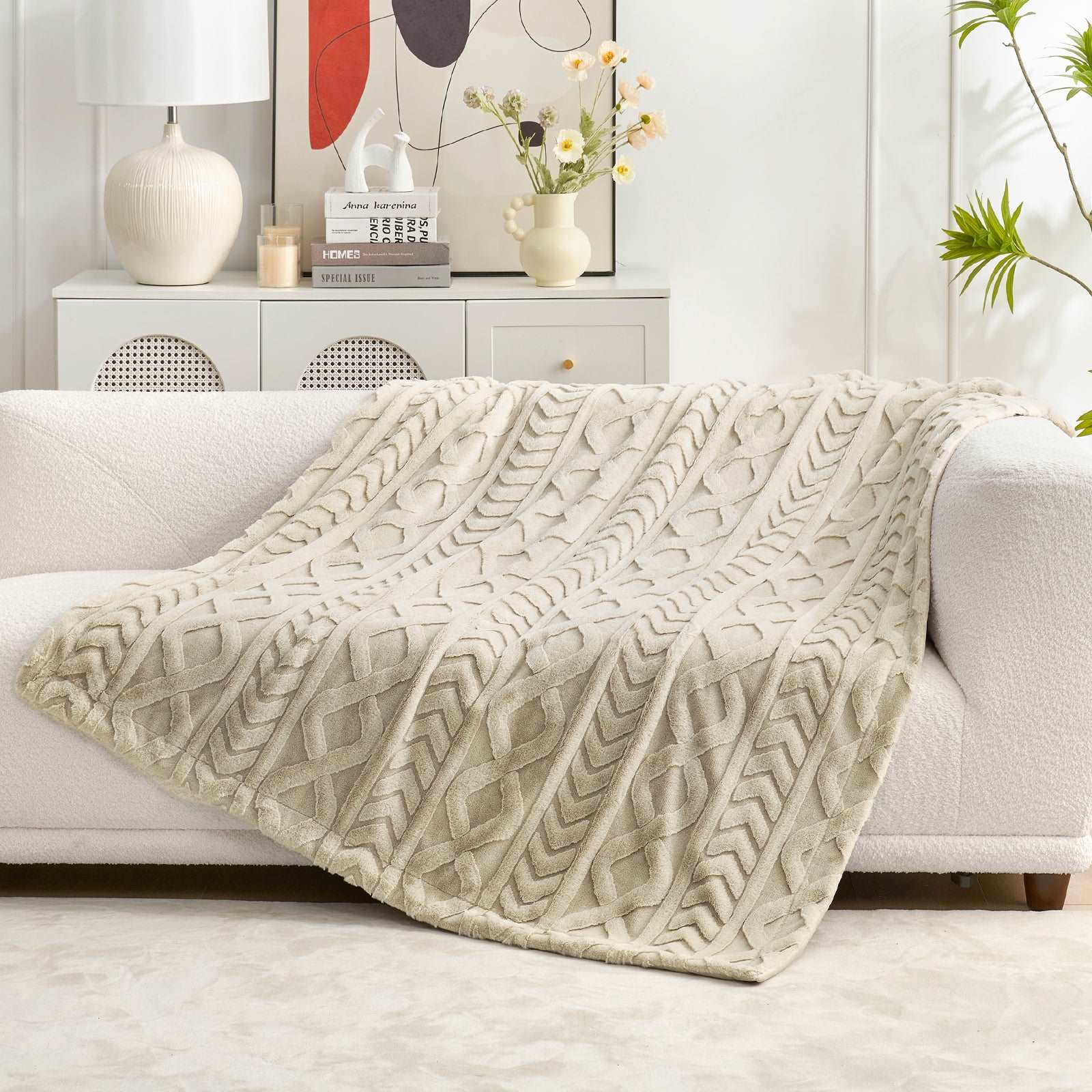 Cream cable knit faux fur throw blanket on white sofa #color_Khaki