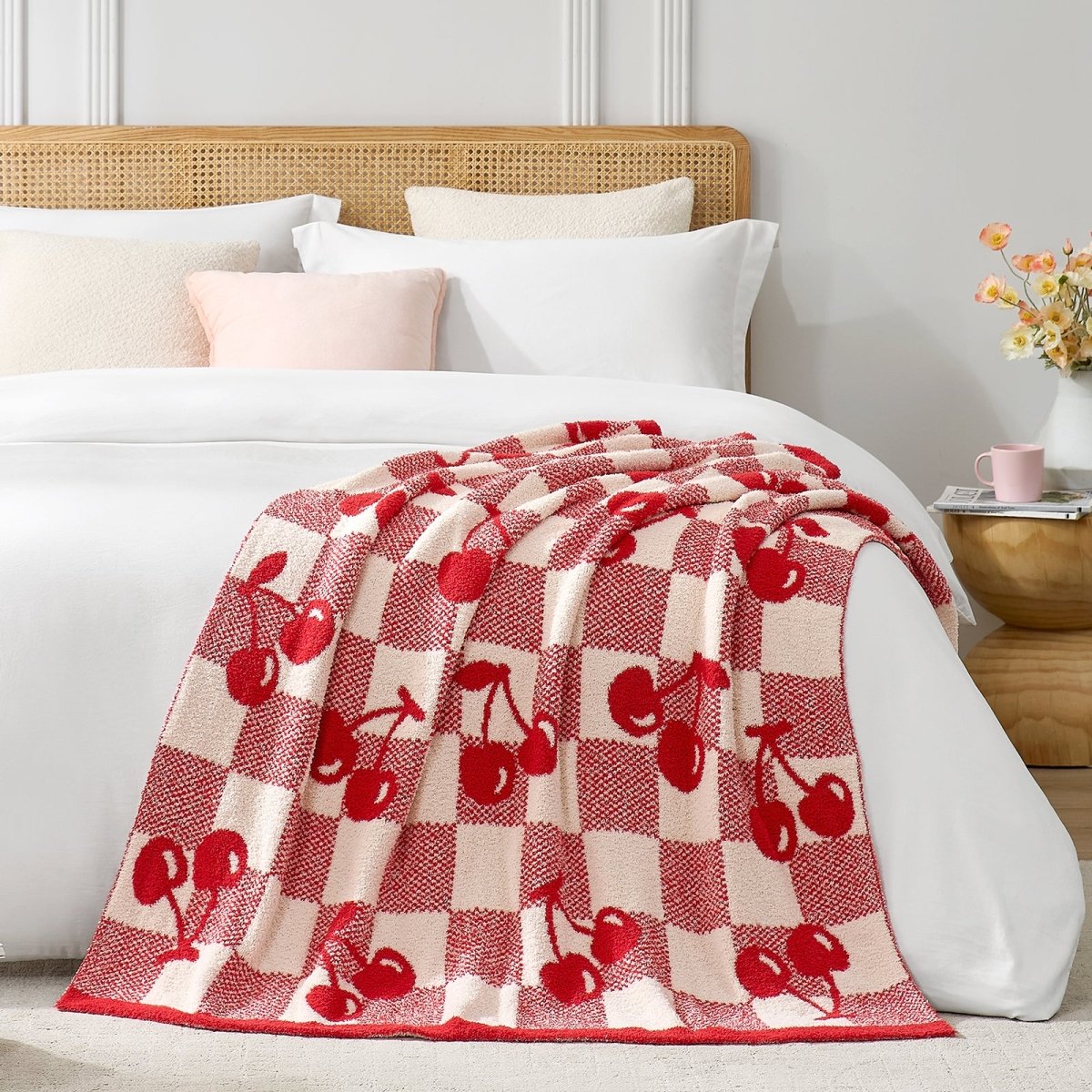 Reversible Checkered With Red Cherry Throw Blanket in Red Cherry styled on a bed, showcasing soft texture and cherry checkered pattern design. #color_Red Cherry