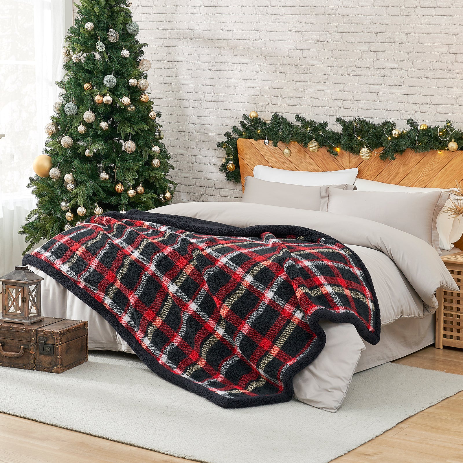Bedroom with a plaid blanket, Christmas tree, and decorated wall. #Color_Scotland Plaid Red