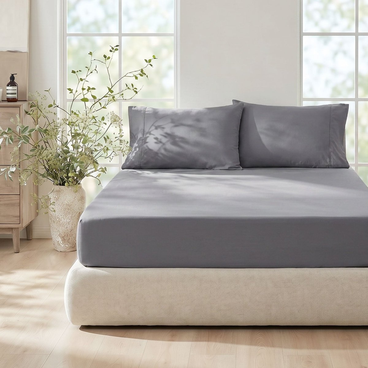 Cozy Bliss dark grey cooling fitted sheet set on a bed in front view.#Color_Dark Grey