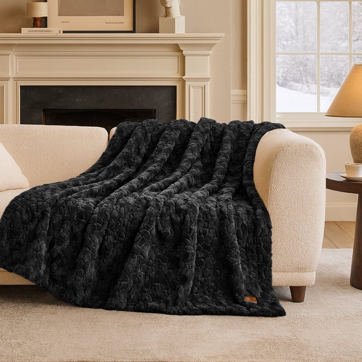 Premium Brushed Faux Fur Throw Blanket draped over a modern accent chair with elegant plush texture #color_Black