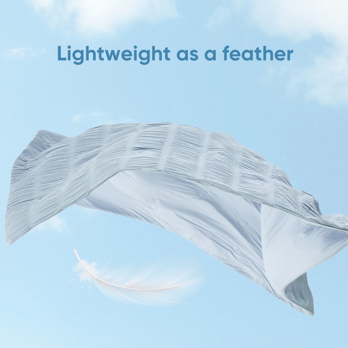Cooling comforter floating in air, lightweight breathable fabric for cool and comfortable sleep.#color_Cool Blue