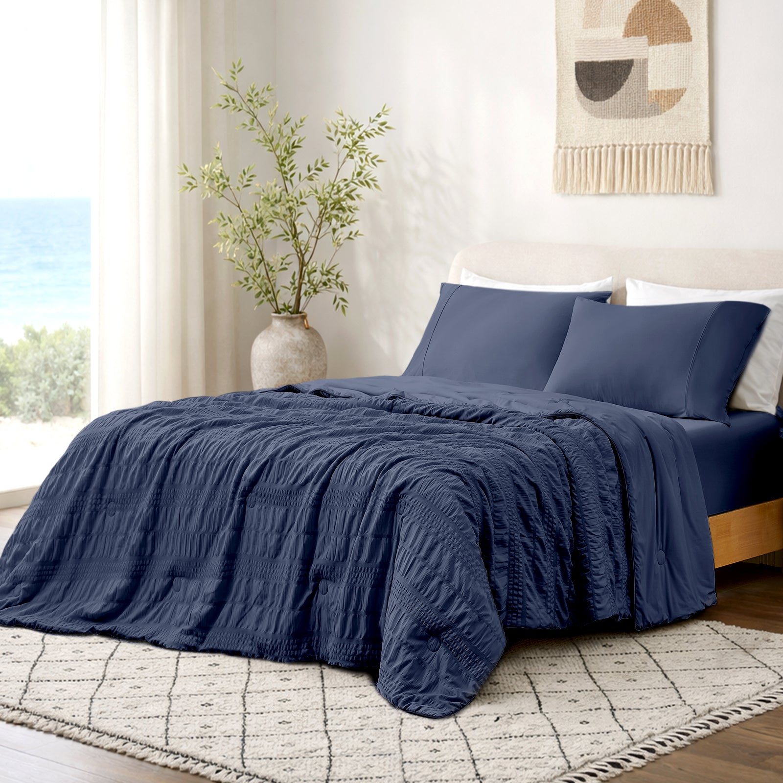 Cozy Bliss Seersucker cooling comforter in navy blue, soft and breathable for cool sleep.#color_Navy Blue