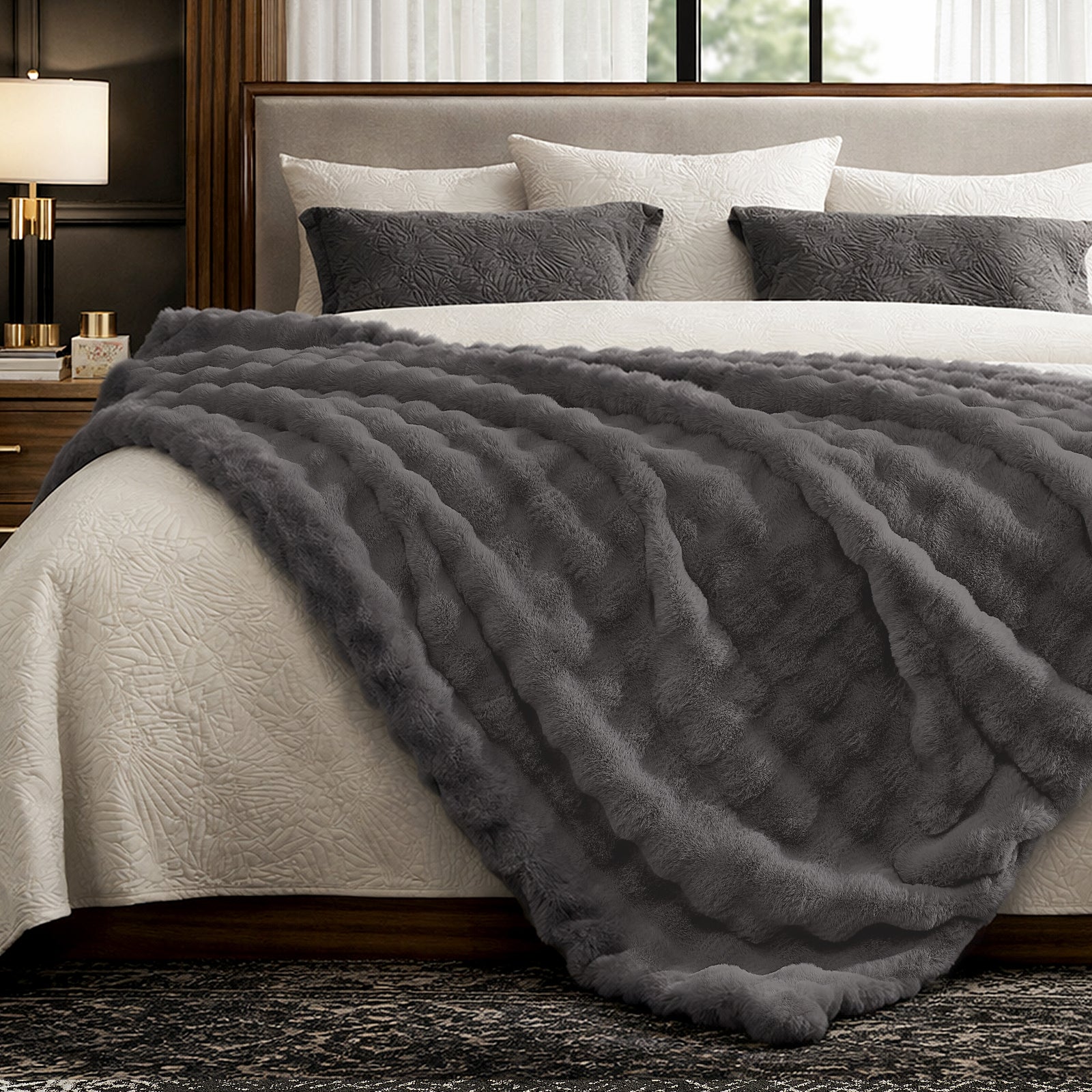 Charcoal grey faux fur throw blanket on bed. Cozy and soft blanket for bedroom comfort #color_Charcoal Grey