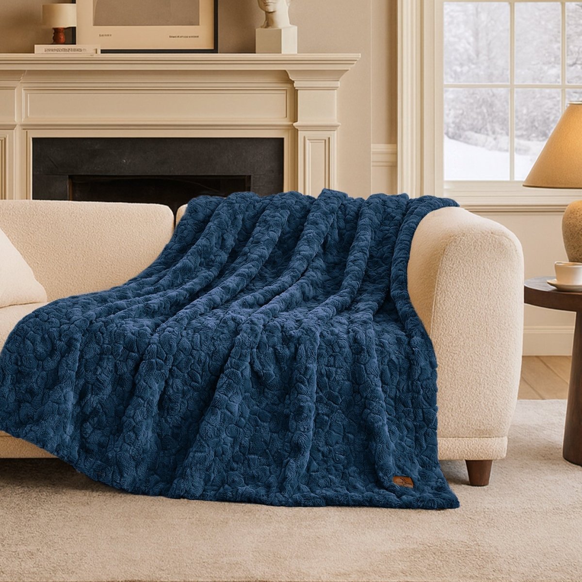 Cozy Bliss premium faux fur throw blanket styled across a sofa with a cozy winter atmosphere #color_Navy Blue