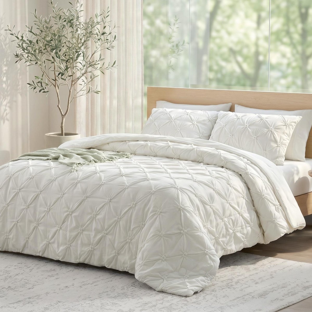 Cozy Bliss white pintuck design cooling comforter on a bed, designed for hot sleepers and night sweats.#color_Off White