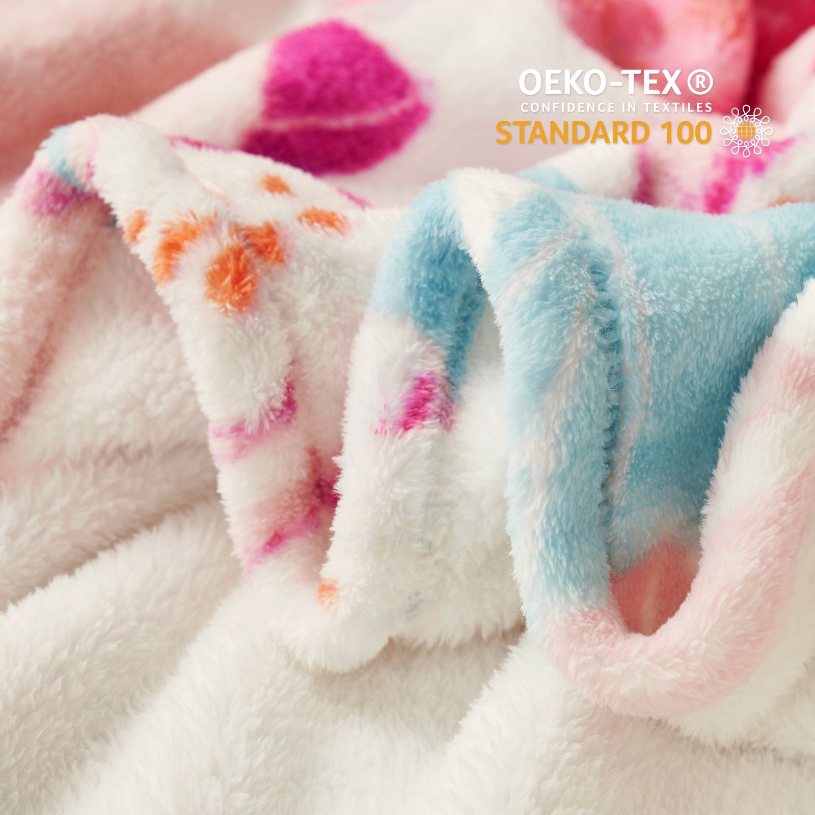 Close-up of soft fabric with colorful patterns and OEKO-TEX certification logo. #color_Garden Fairy