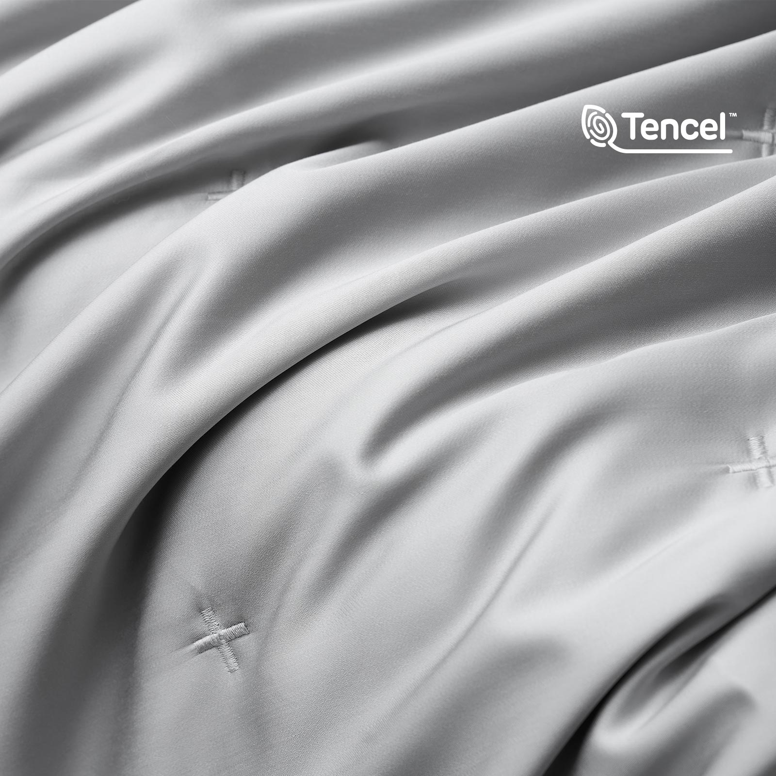Close up of silky smooth Tencel™ lyocell cooling fabric with OKEO-TEX Standard 100 certification.#Color_Grey