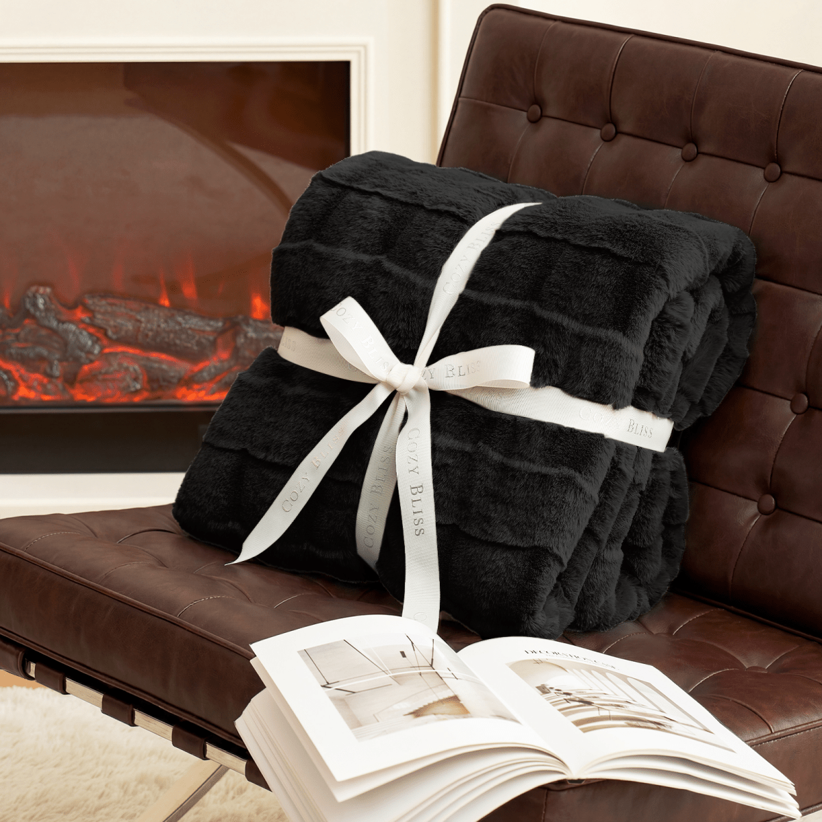 Fluffy black blanket with a bow on a armchair. #Color_ Black