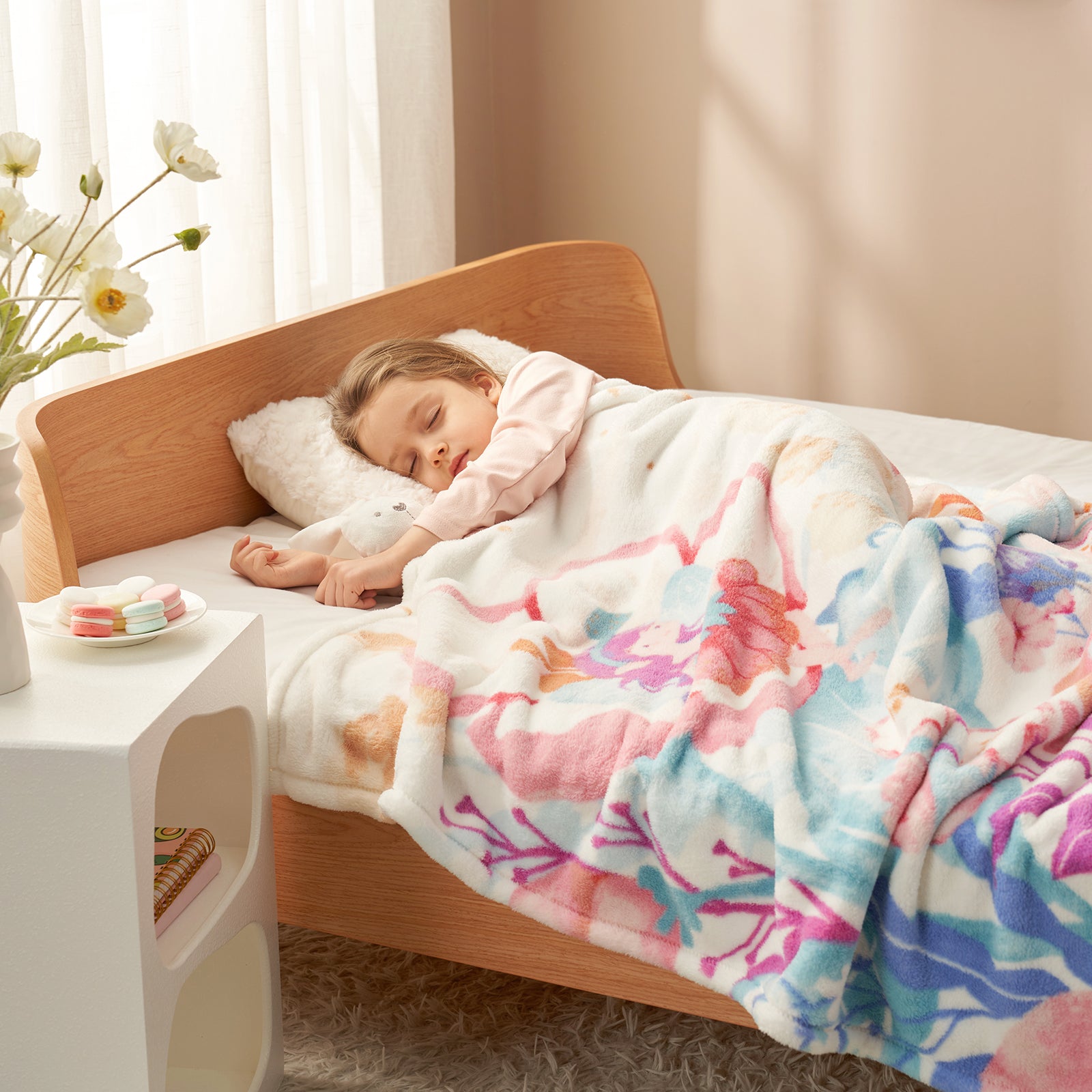 Child sleeping in a bed with a colorful floral blanket in a cozy bedroom. #color_Garden Fairy