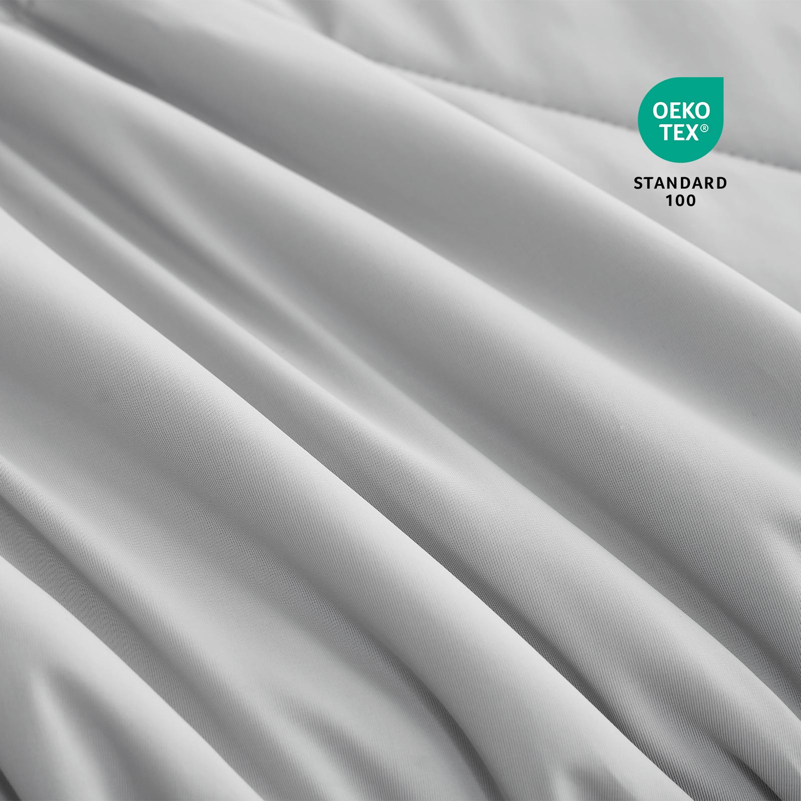 Close-up of OEKO-TEX certified cooling comforter fabric. #Color_Light Grey
